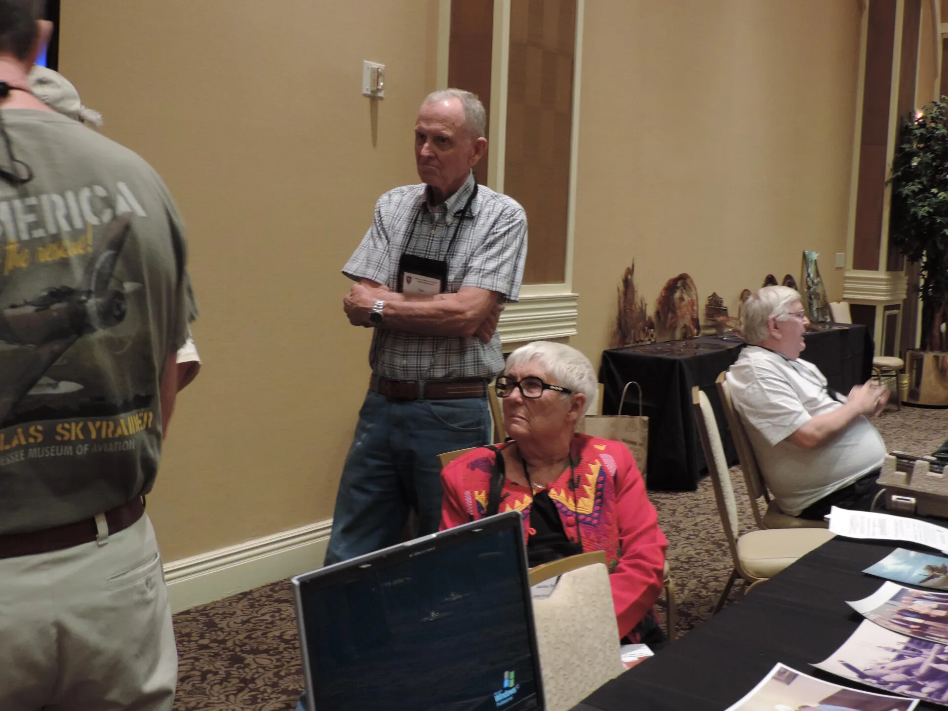 Reunion Attendees at the Display Tables, with Douglas Skyraider Souvenir Shirt, Special Operations Association Reunion, Las Vegas, 2013