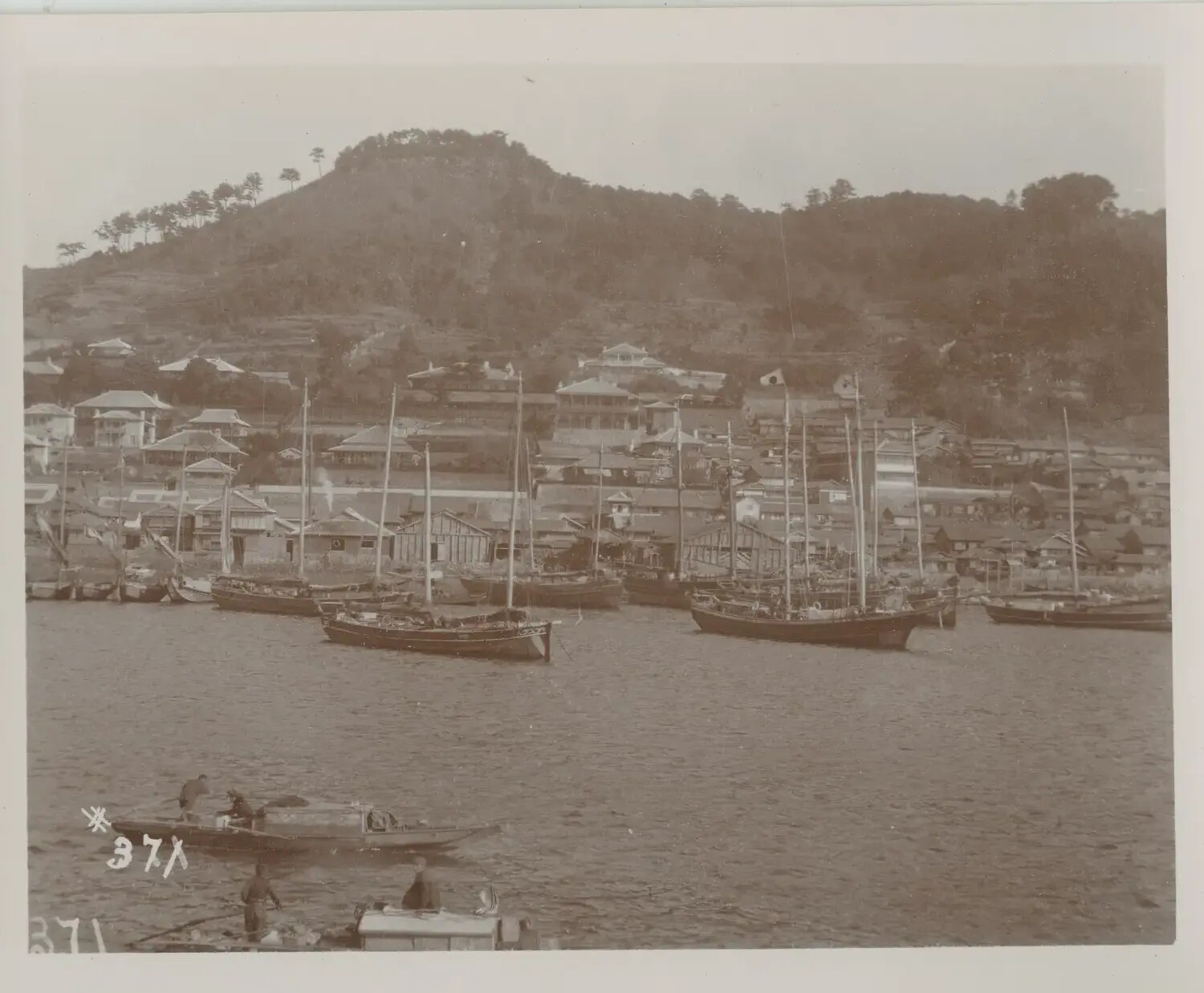Japanese Sailing Vessels in Harbor Below Hillside Town, Likely Nagasaki, Japan, c. 1890s