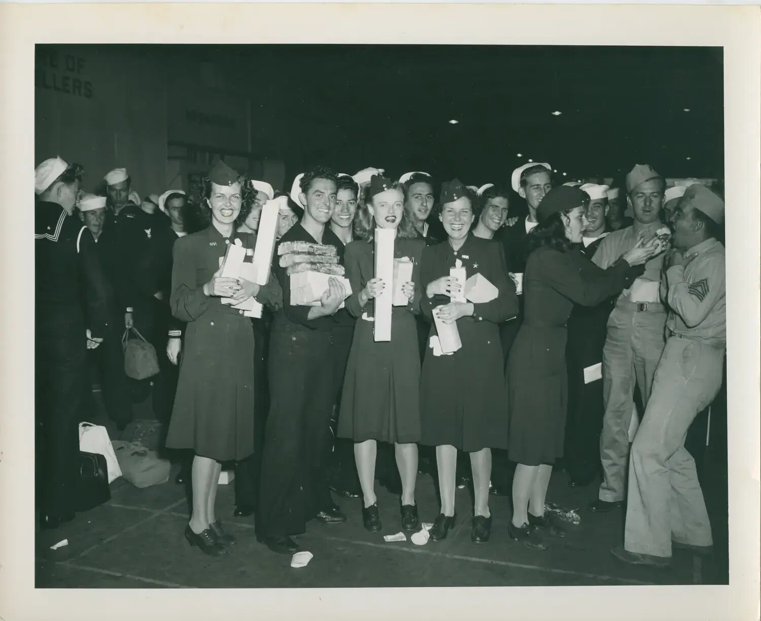 Sailors and Servicewomen Celebrate at Indoor Gathering, USS Petrof Bay (CVE-80) Collection, WWII