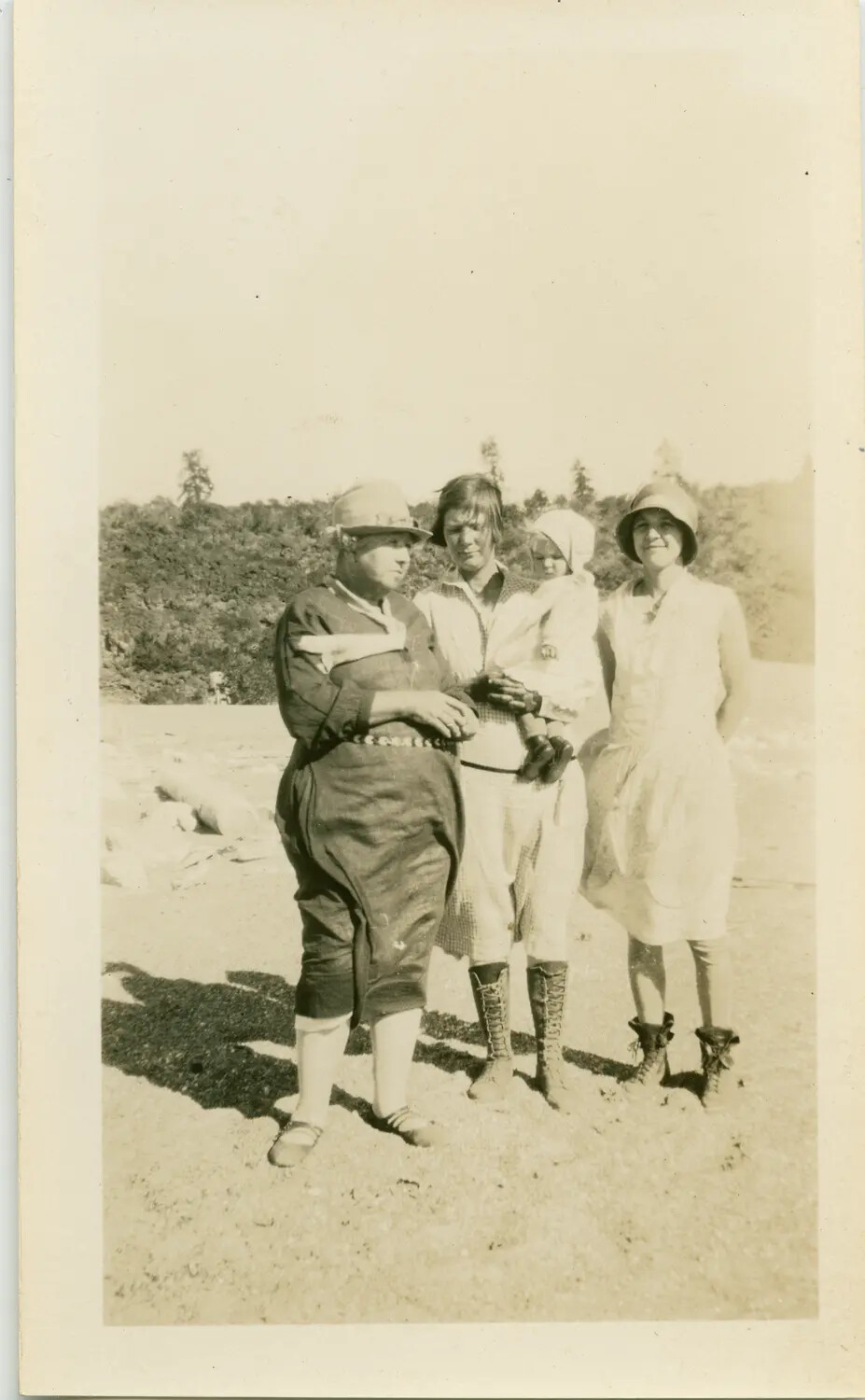 Group Portrait of Three Women and a Child on a Rocky Shoreline, c. 1920s