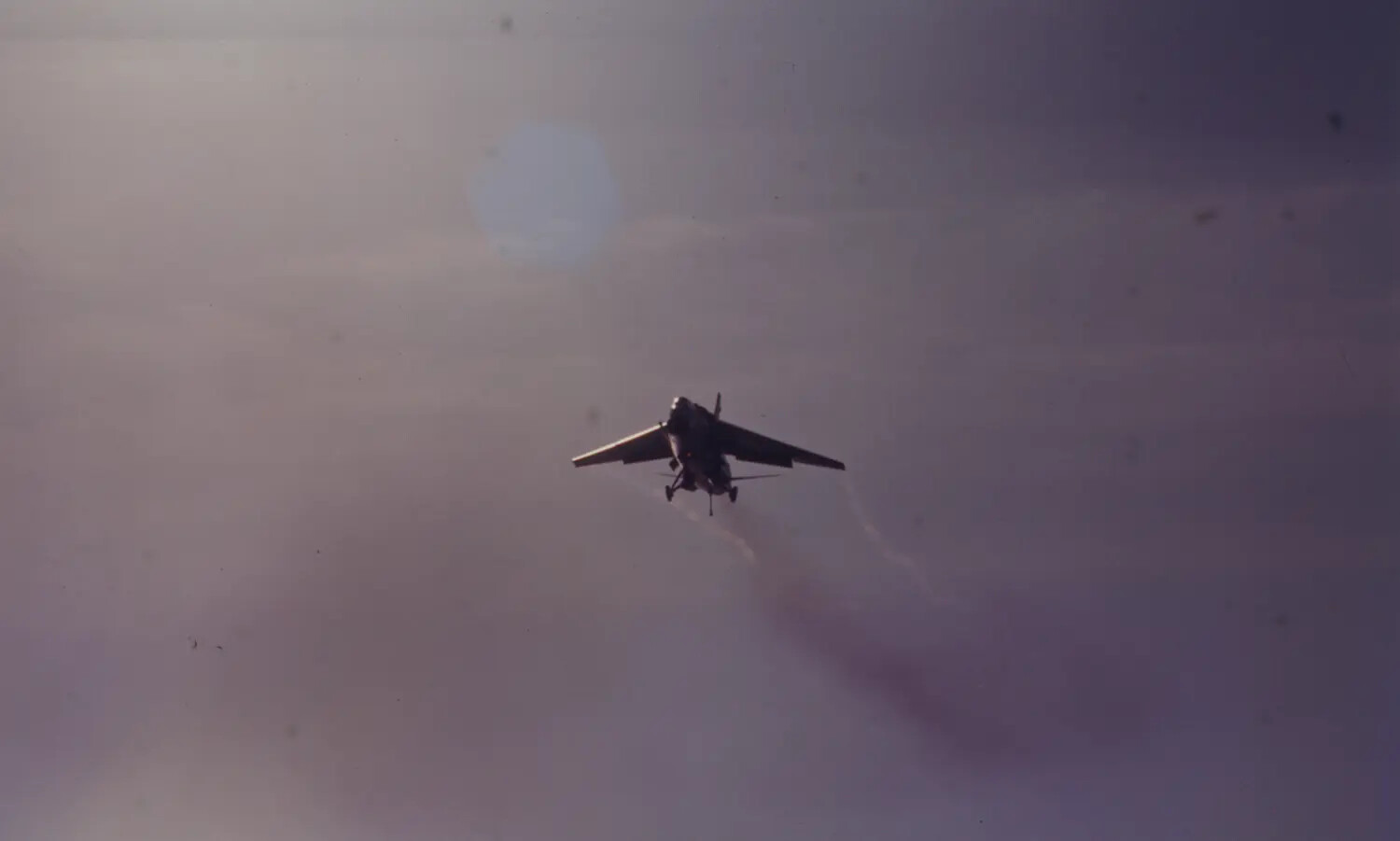 Silhouetted Jet Fighter Trailing Smoke, USS Ticonderoga Air Wing Slide Collection, Vietnam War Era
