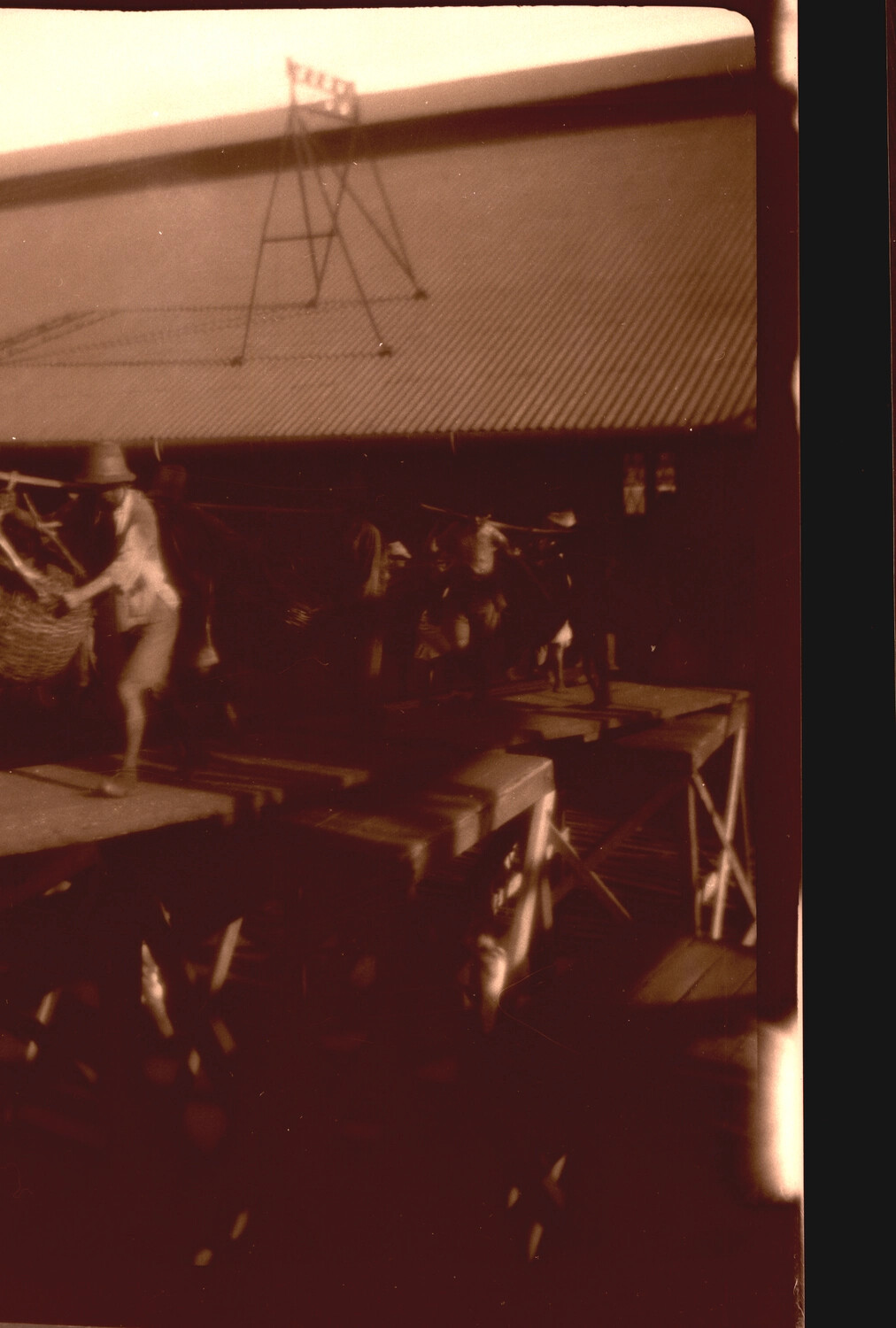 Waterfront Loading Dock Scene with Laborers Carrying Shoulder-Pole Baskets, China, 1930s