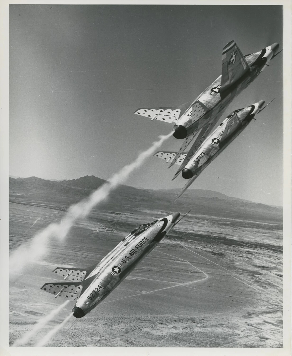 Thunderbirds F-100s Performing Bomb Burst Split Maneuver Over Desert Valley