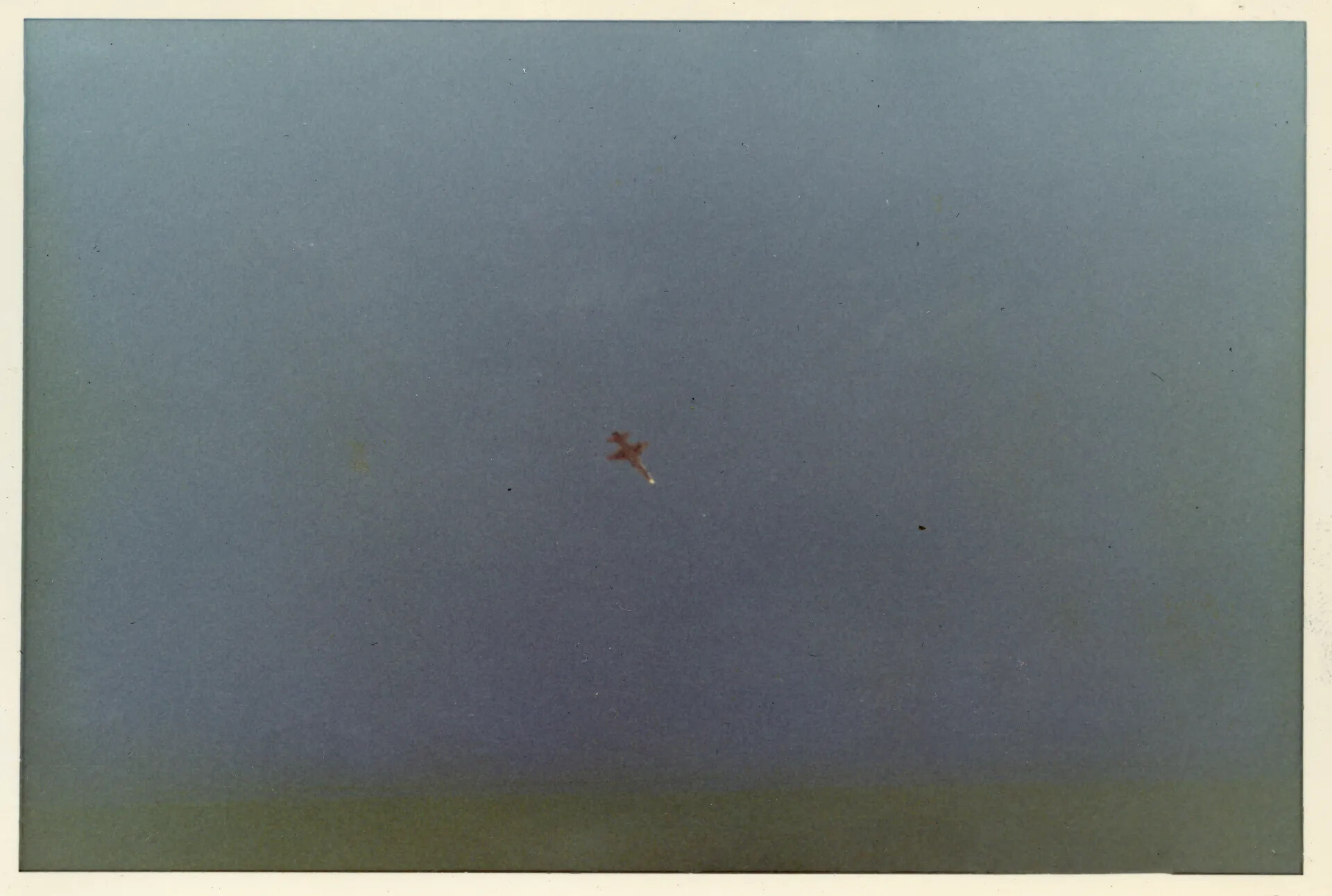 Distant Aerial View of Single-Engine Propeller Aircraft in Flight, Vietnam Era