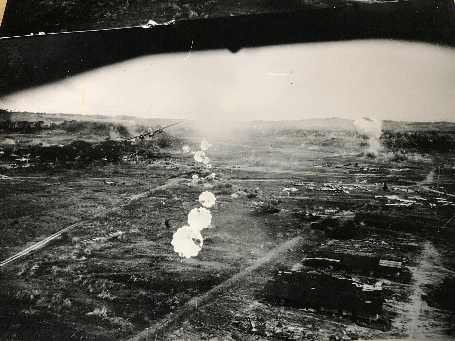 Full Album Scan: B-25 Mitchell Releasing Parafrag Bomb Train Over Airfield