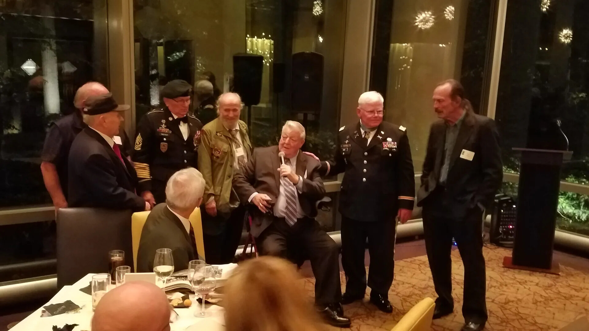 Group Portrait of Veterans at Evening Reception with Podium, Likely Gary Michael Rose Medal of Honor Reunion, October 2017