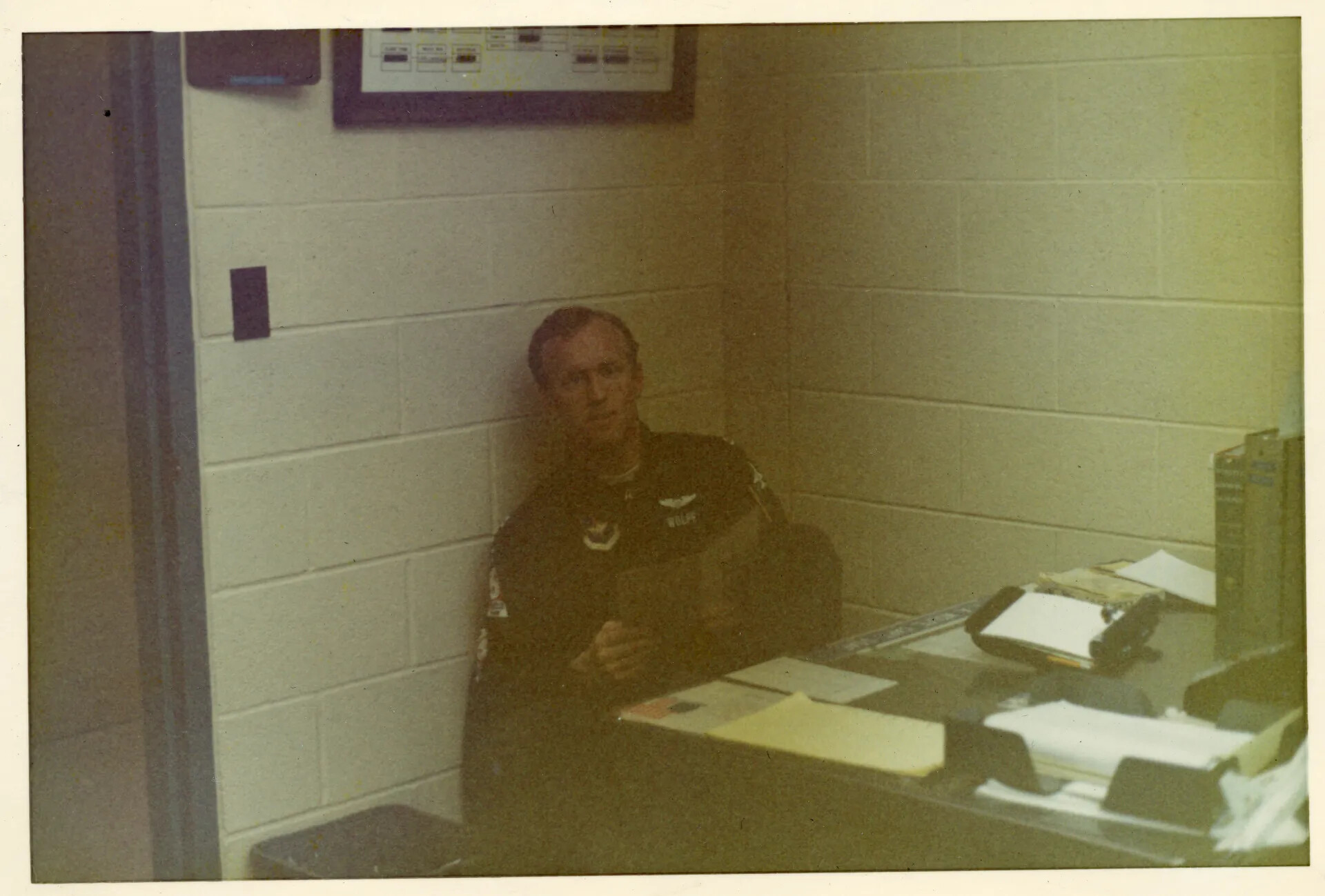 Pilot 'Wolfe' Seated in Squadron Operations Room, Vietnam Era
