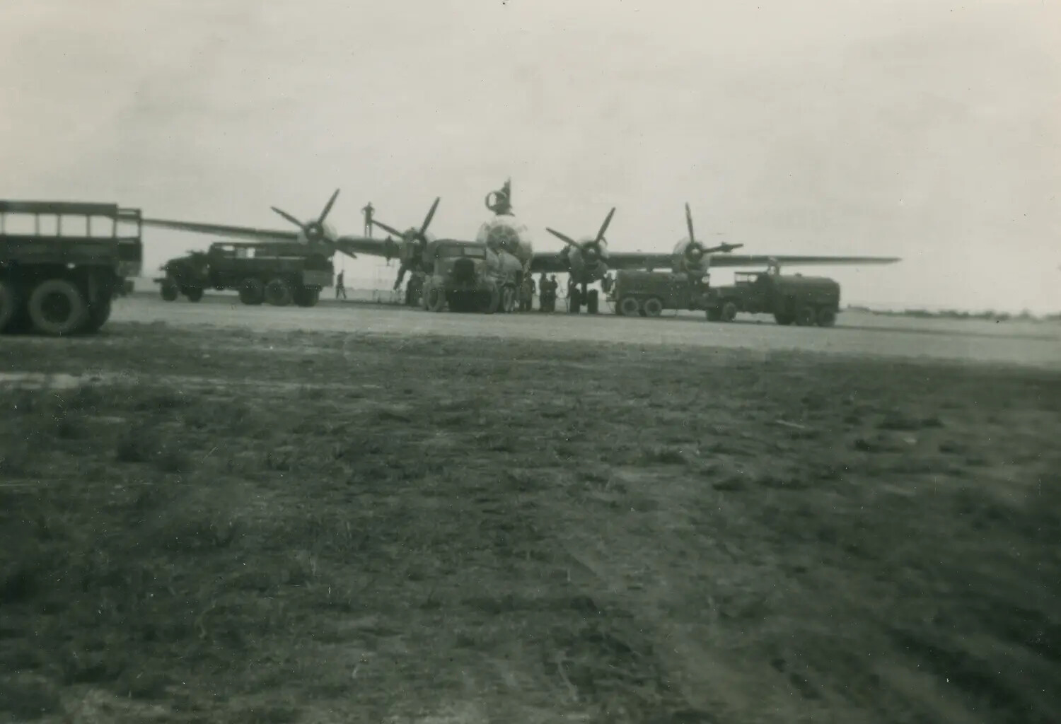 Four-Engine Heavy Bomber Being Serviced on Ramp, WWII Army Air Forces Base
