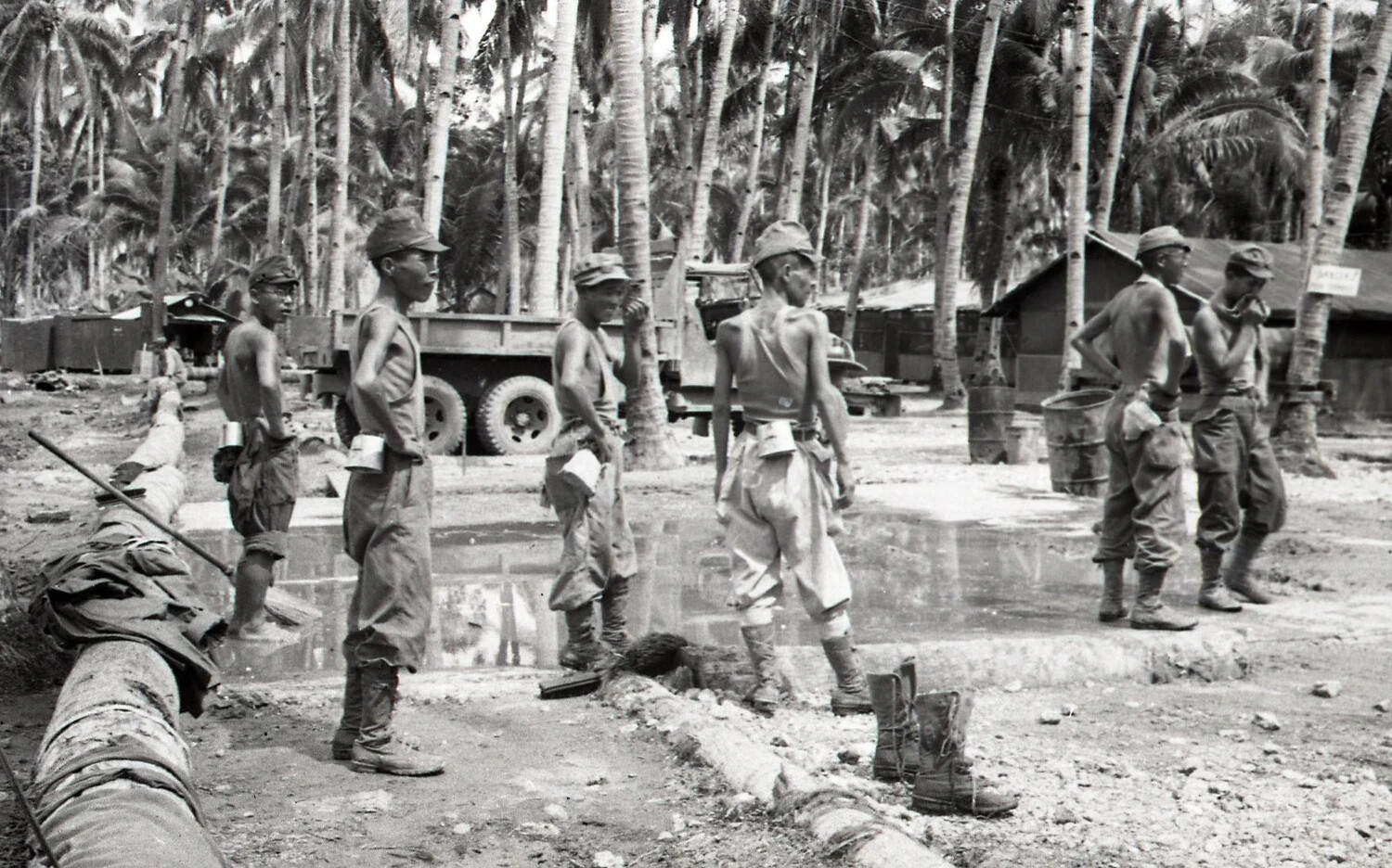 Construction Crew Resting Beside Concrete Slab at Military Camp, Luzon, Philippines, WWII