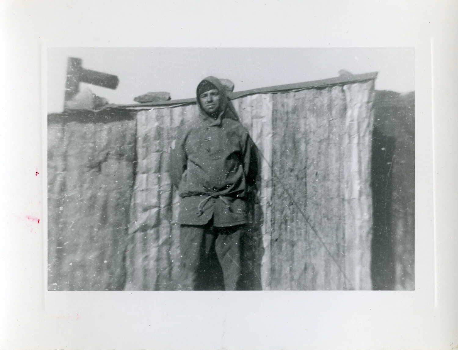 Serviceman in Hooded Parka Beside Corrugated Metal Wall, Aleutian Islands, World War II