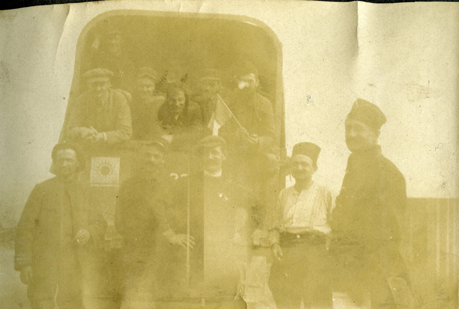 Group Portrait of French Servicemen and Civilians at Rear of Truck, WWI French Pilot Album