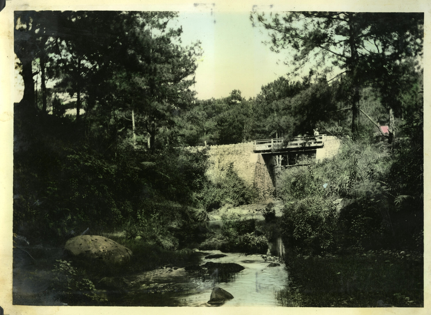Hand-Tinted Landscape Photograph, Stone Footbridge Over Mountain Stream, Pine Forest, Early-Mid 20th Century