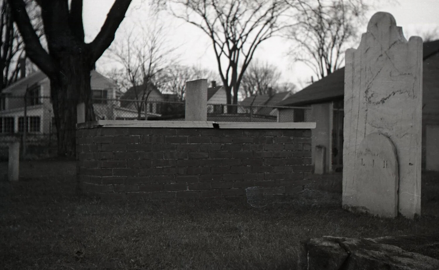 Weathered Slate Headstone and Brick Tomb, Suburban New England Burying Ground