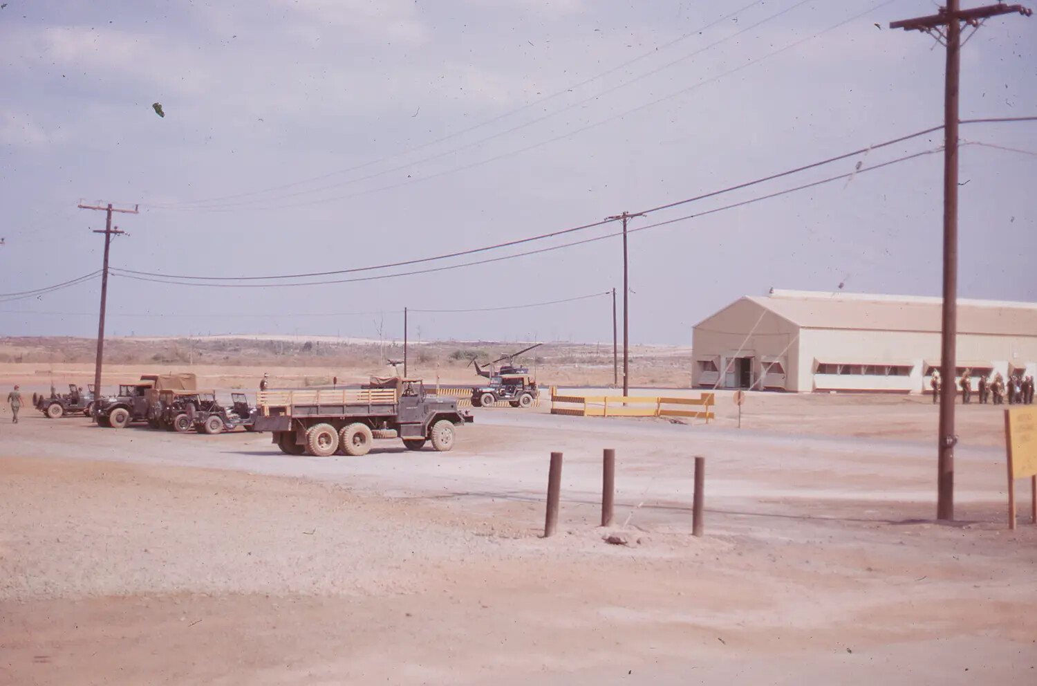 US Military Vehicles, Helicopter, and Hangar at a South Vietnam Base, 1968 Tet Offensive Collection