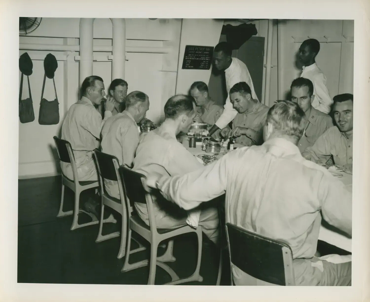 U.S. Navy Officers Dining in Wardroom Aboard USS Petrof Bay (CVE-80), WWII Era