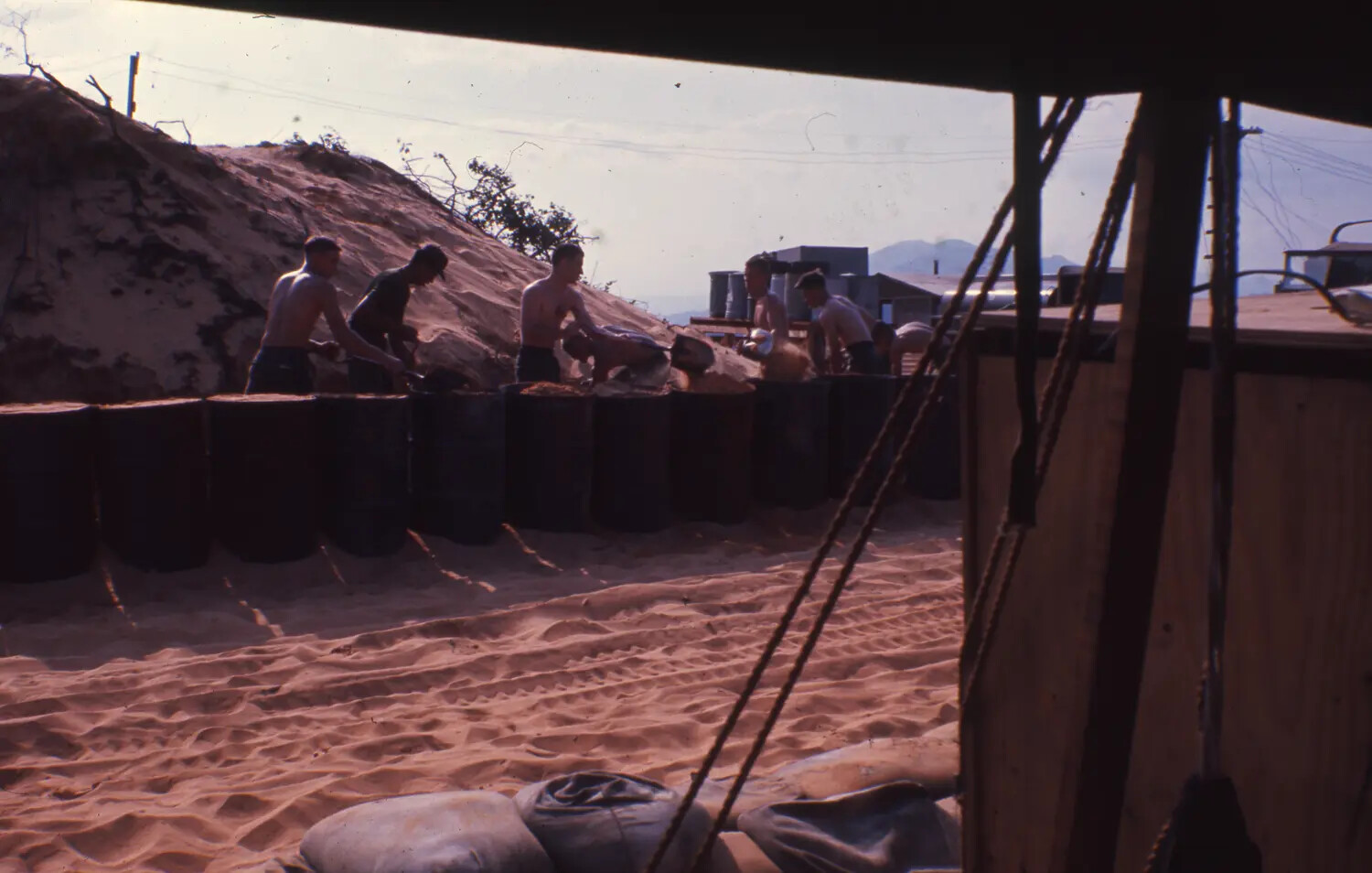 Vietnam War Era Color Slide: Soldiers Filling Sand-Filled Drums for Defensive Revetment, Cam Ranh Bay, Vietnam