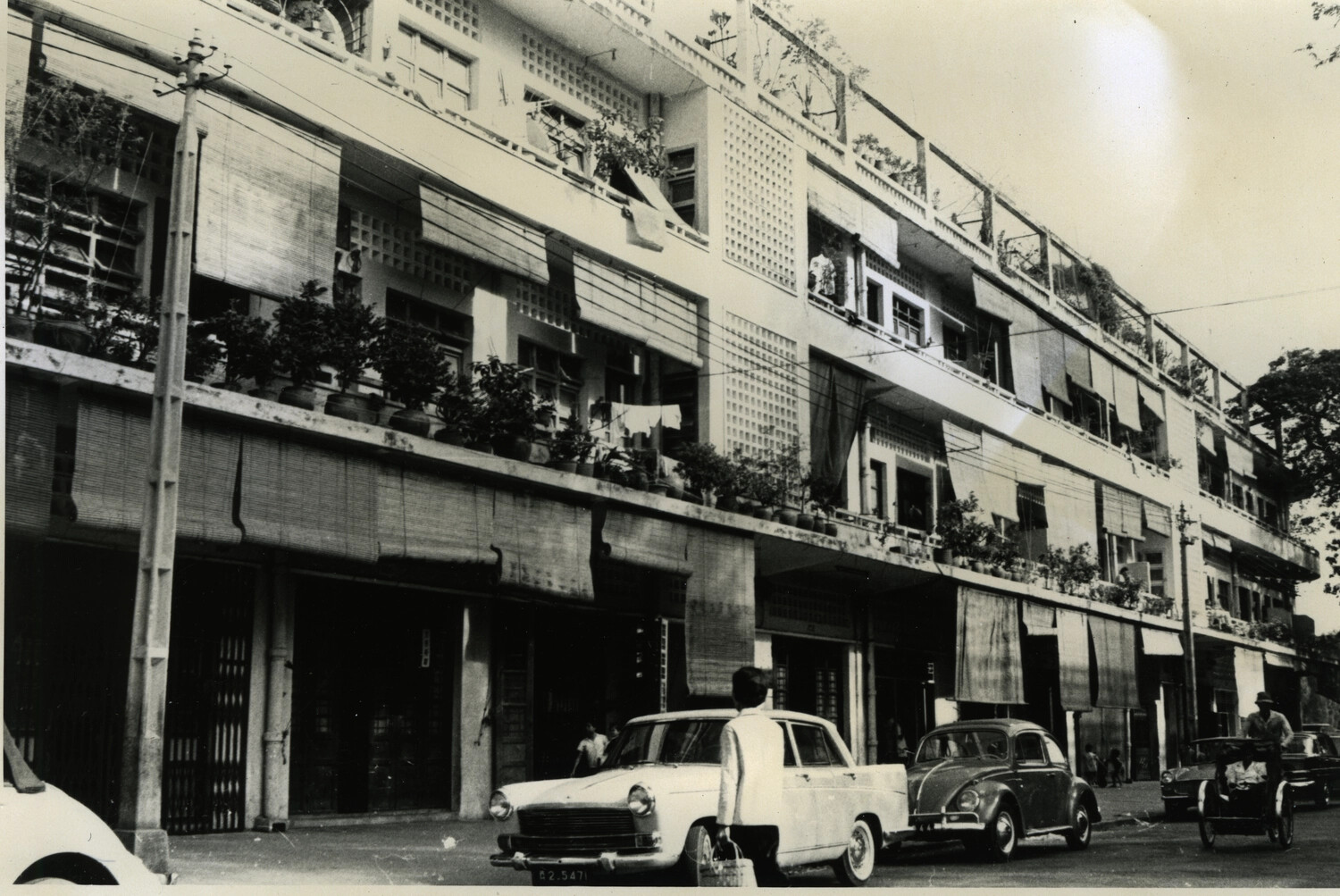 Shophouse Row with Parked Vehicles, Phnom Penh Street Scene