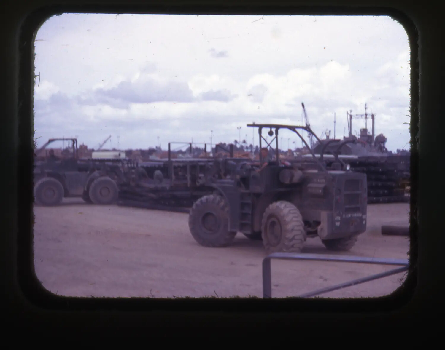 Military Rough-Terrain Forklift Handling Pierced Steel Planking, Vietnam War Logistics Base (Cam Ranh Bay)