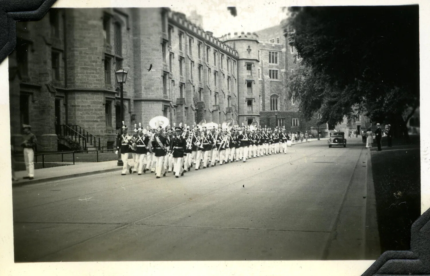 Cadet Corps Band and Parade Formation Passing Collegiate Gothic Barracks, c. 1930s
