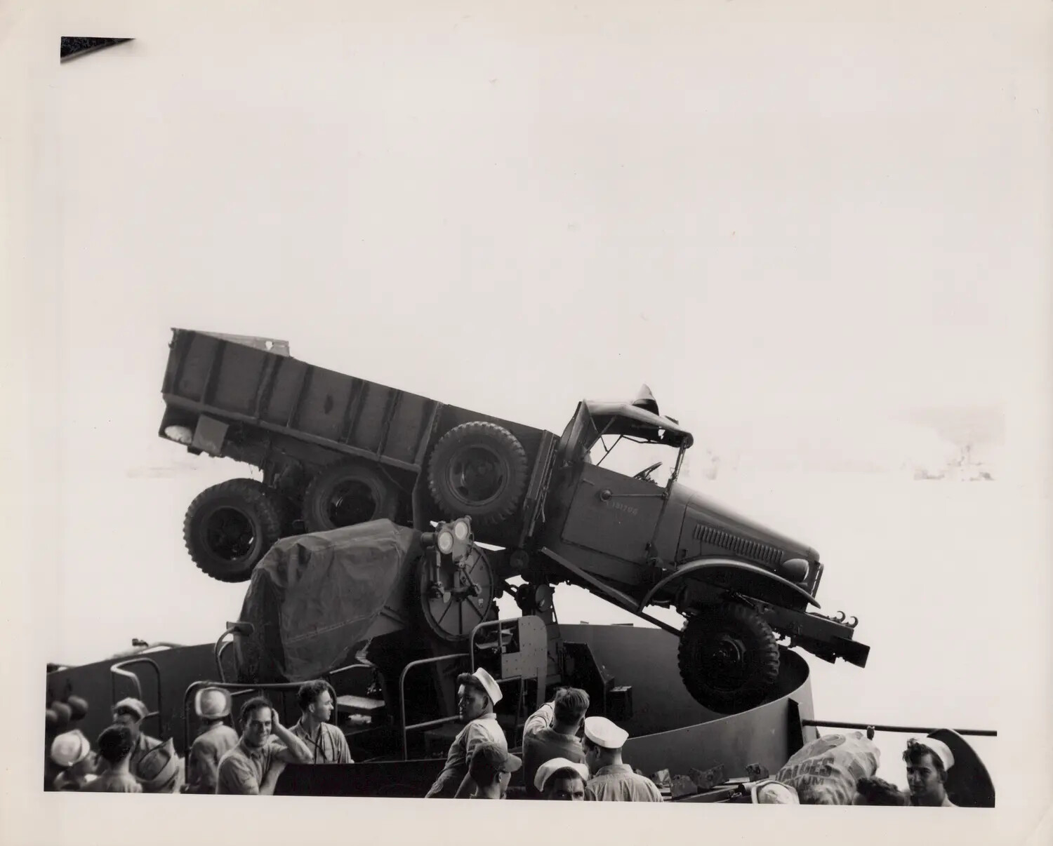 GMC CCKW Cargo Truck Perched Atop Anti-Aircraft Gun Mount Aboard USS Petrof Bay (CVE-80), 21 August 1945