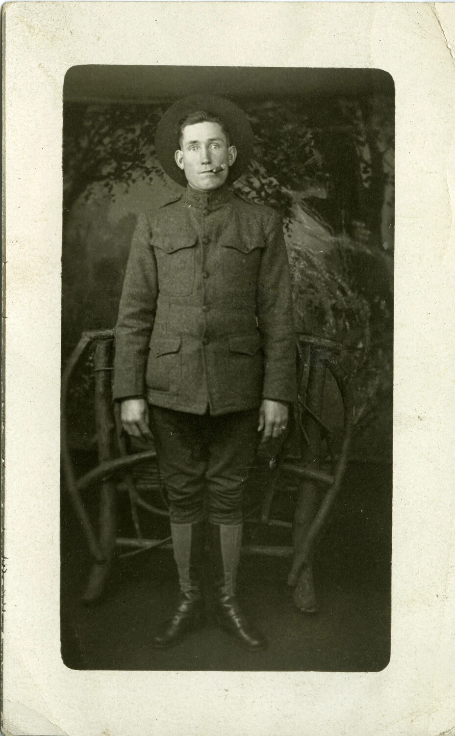 Full-Length Studio Portrait of an American WWI Soldier in Service Uniform and Campaign Hat - Real Photo Postcard