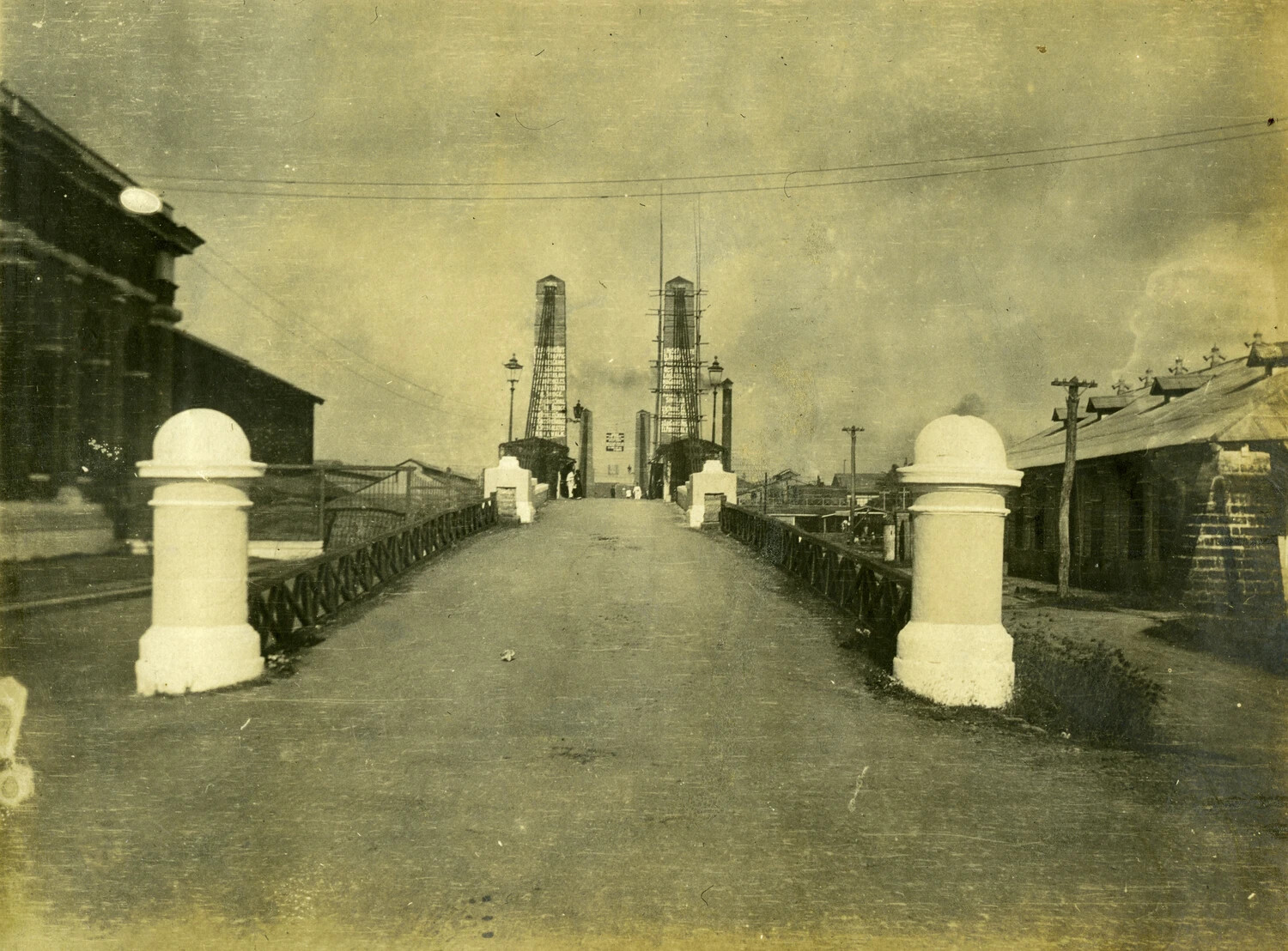 Bridge or Boulevard with Ornamental Bollards and Distant Towers, Philippines, Early 1900s (Stone Album)