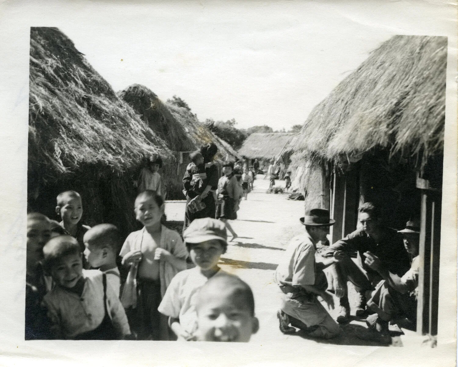 Village Street Scene with Okinawan Children and American Servicemen, Okinawa, WWII Era