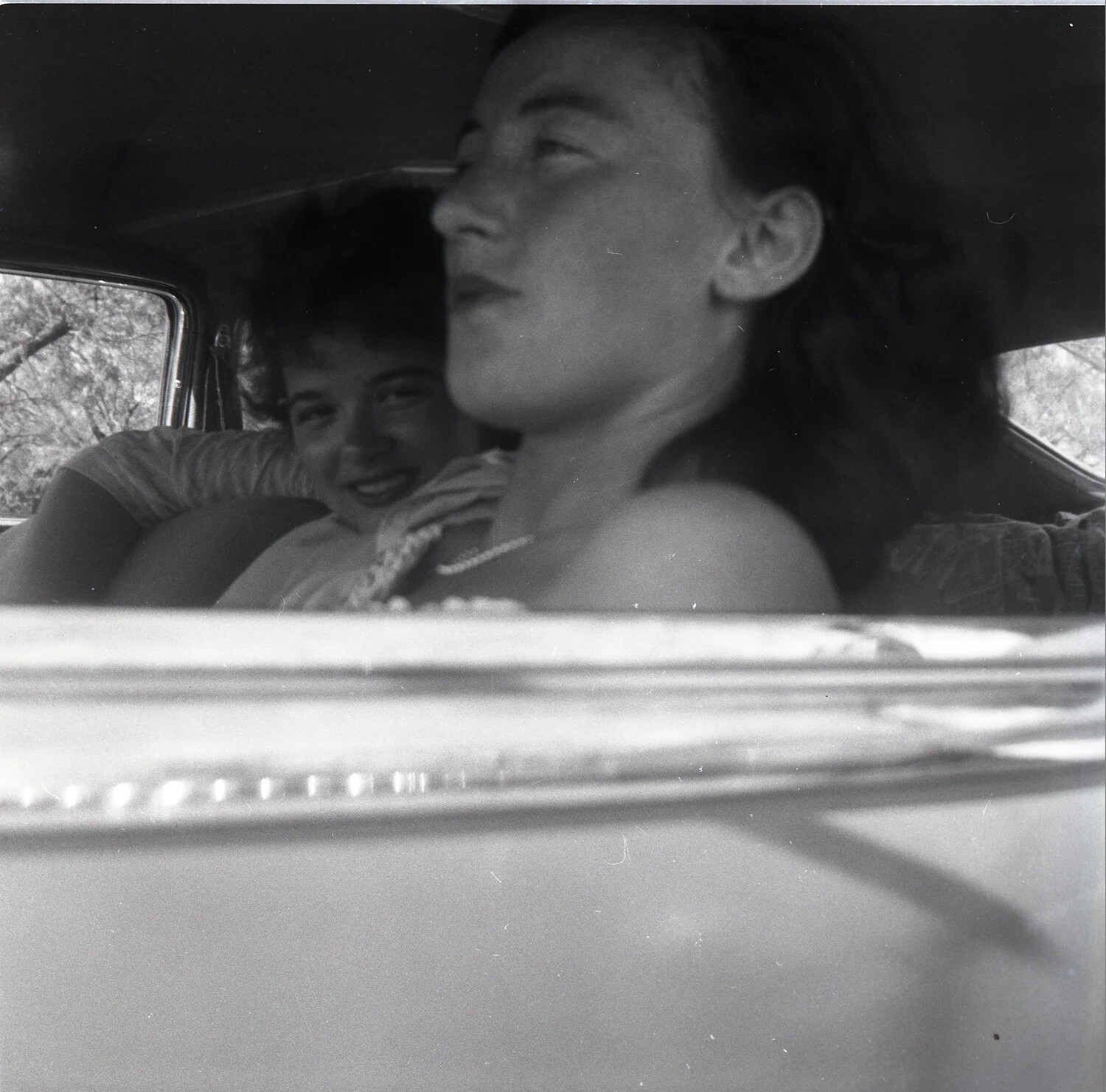 Two Young Women in Automobile, Candid Rear-Seat Perspective