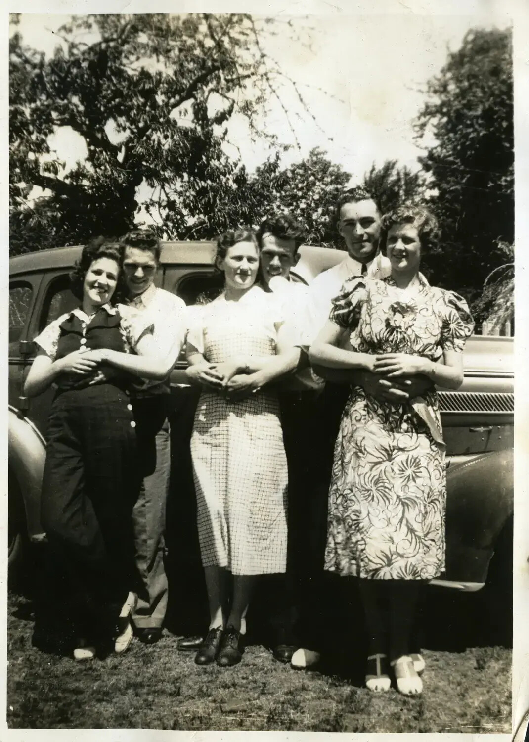 Three Couples Posing by an Automobile, Late 1930s (USS Maryland Photo Album)