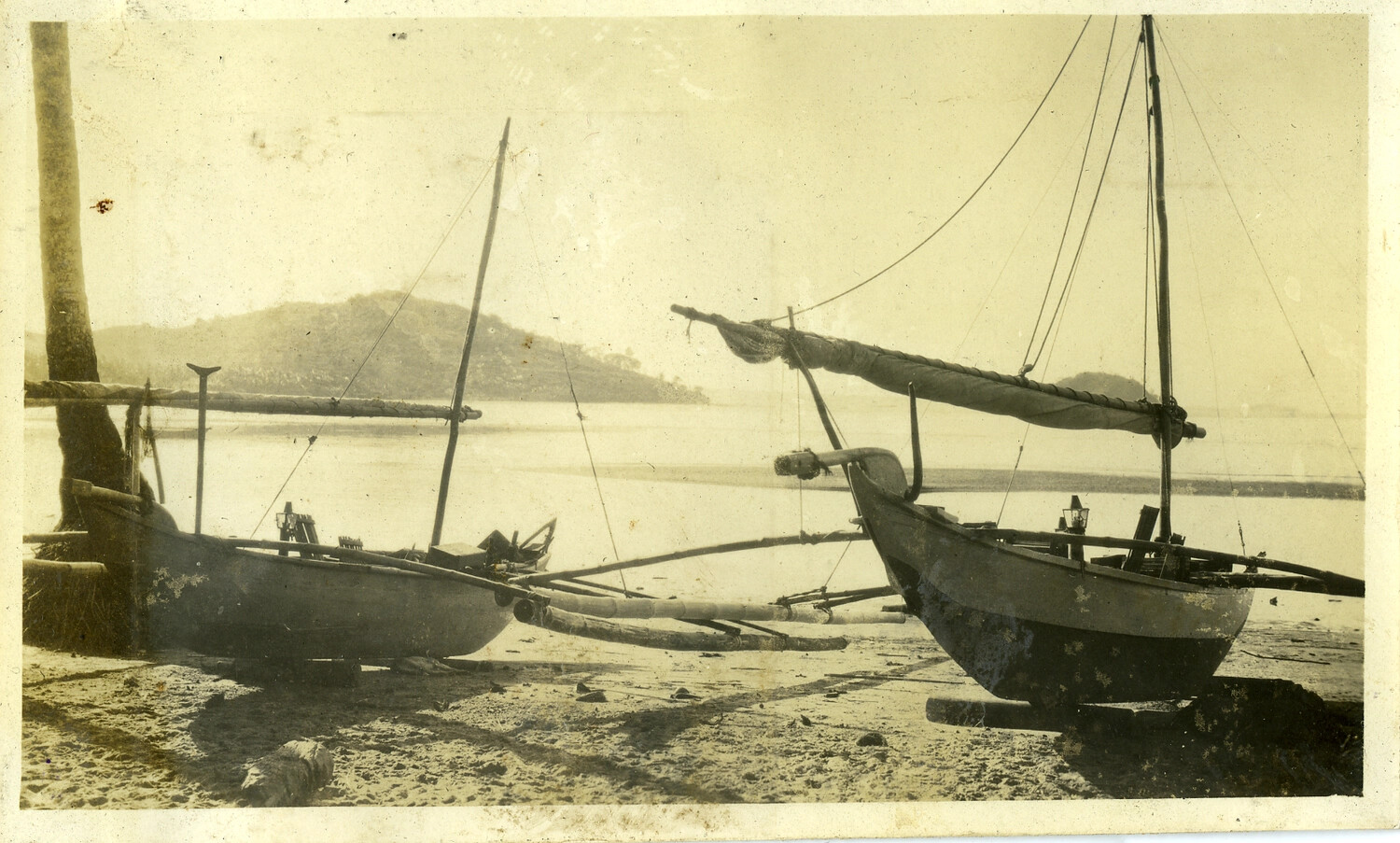 Traditional Outrigger Sailing Boats on a Philippine Beach, Manila Photo Album