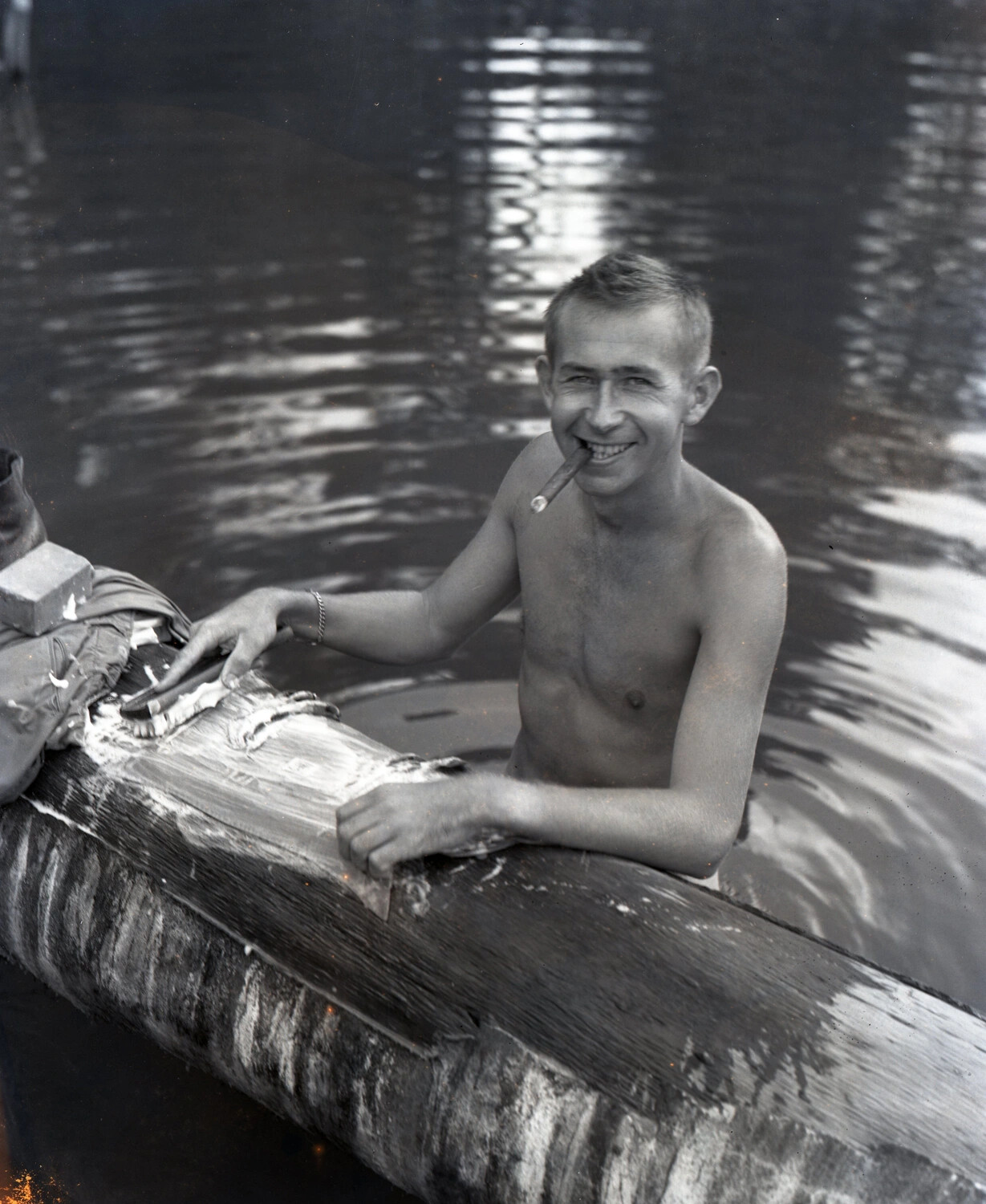 American Serviceman Bathing in River Beside Timber Beam, CBI Theater, WWII
