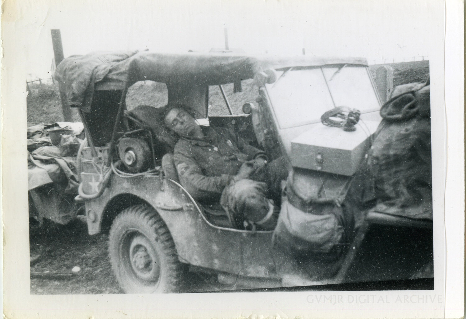 US Army Soldier Asleep in Loaded Jeep with Dog, Signal/Field Equipment Visible, WWII European Theater