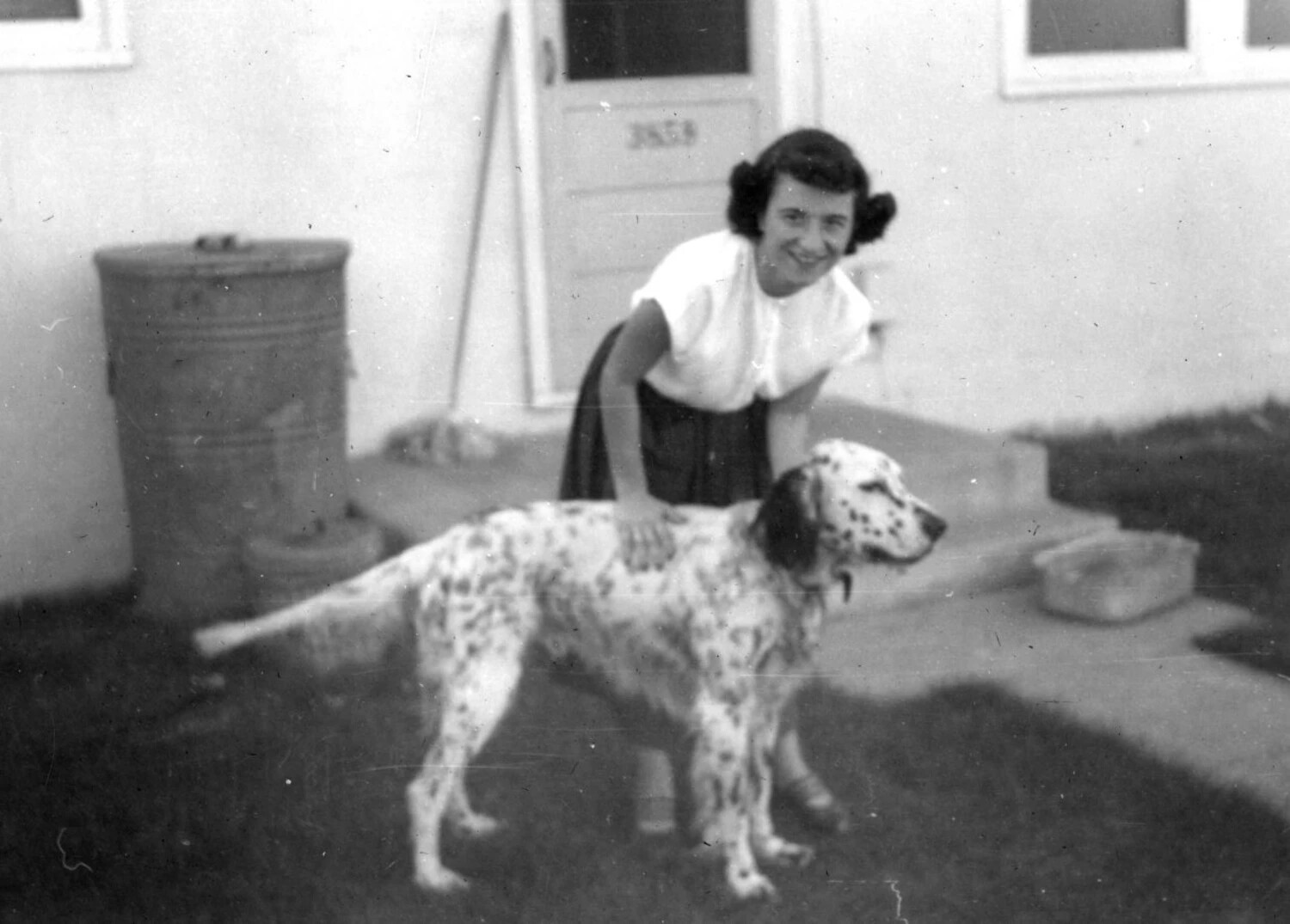 Woman with Spotted Dog in Backyard, Bancroft Family Collection, Korean War Era
