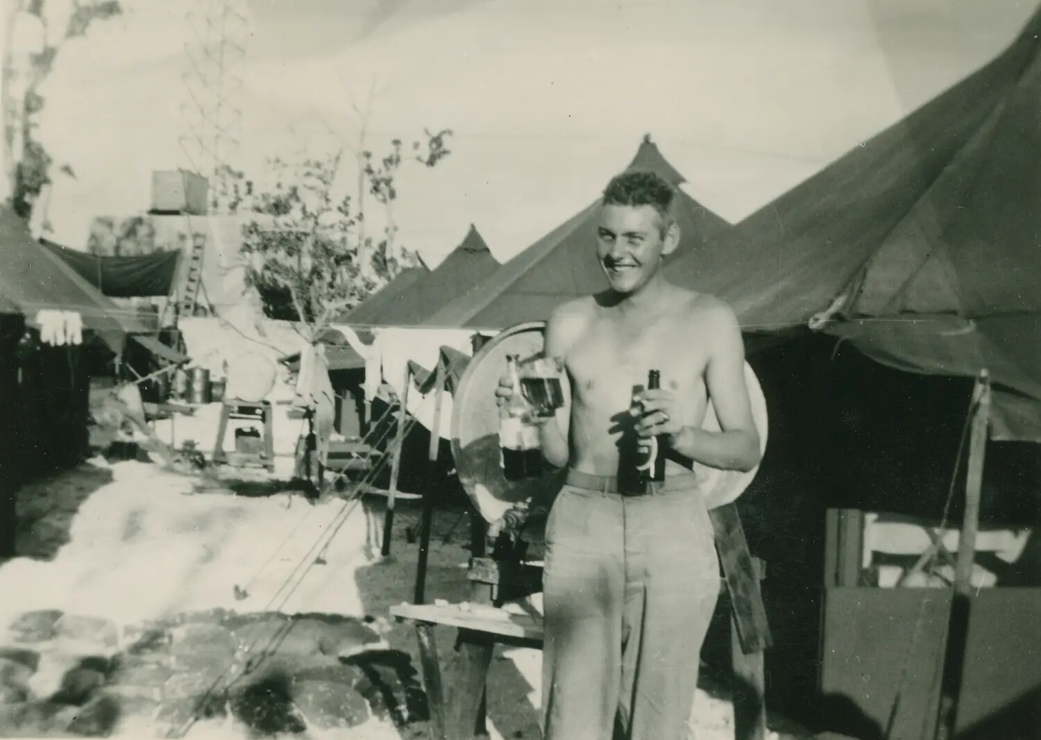 Serviceman at Ease in Tent Encampment, Pacific Theater, World War II