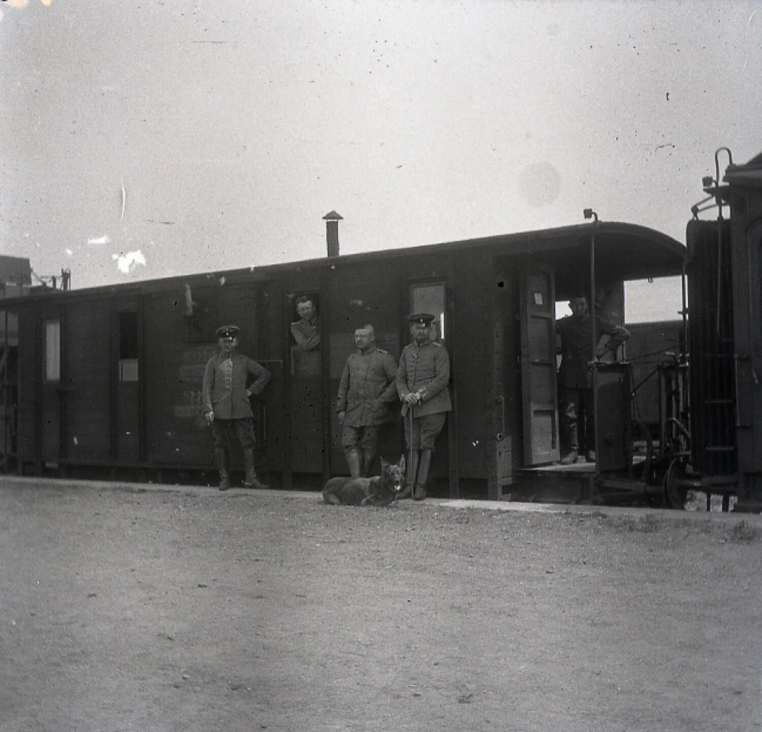 German Army Officers and NCOs Beside a Railway Staff Car with Guard Dog, WWI