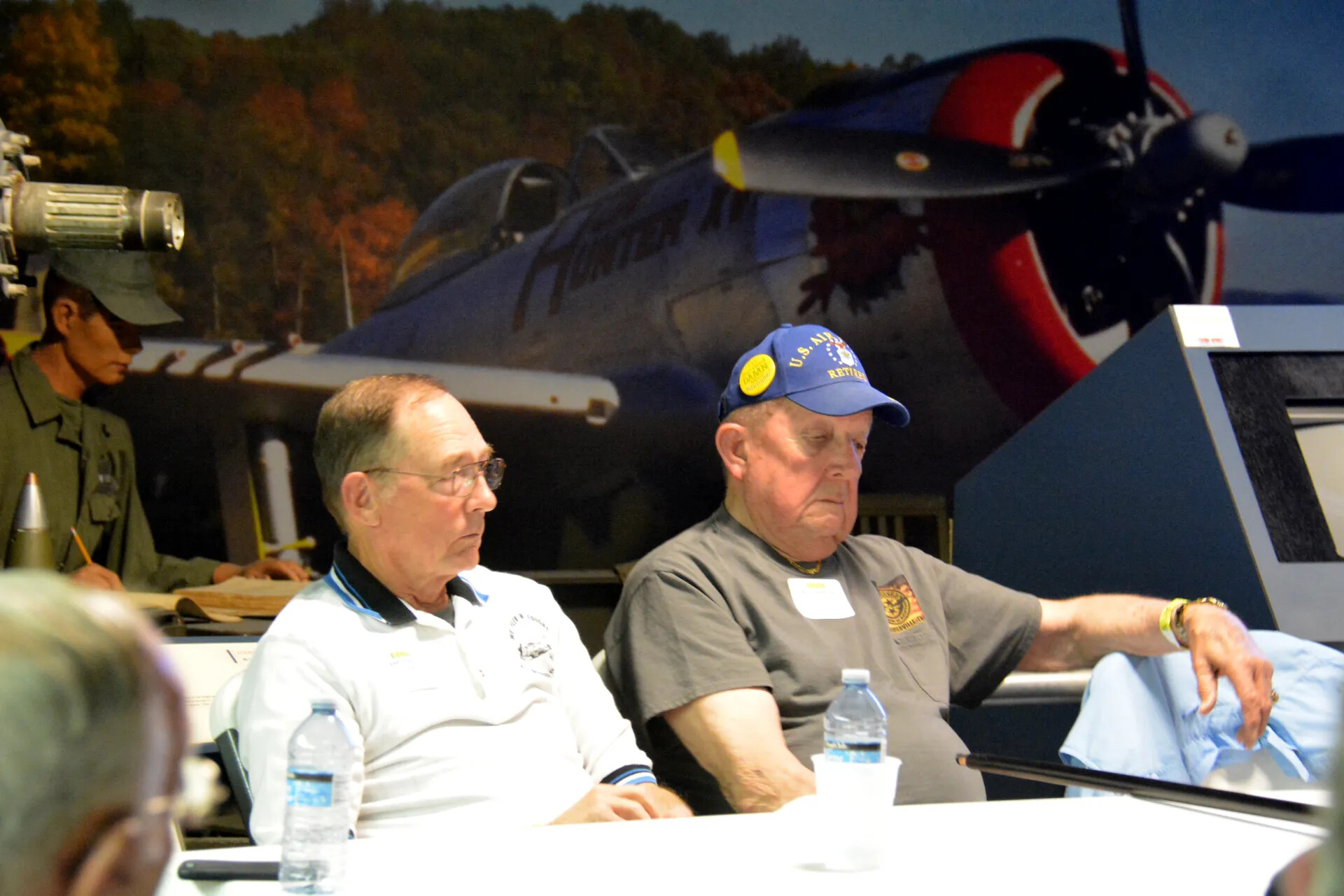 Retired Airmen Seated Before Corsair Mural, Skyraider Association Reunion, 2 May 2015