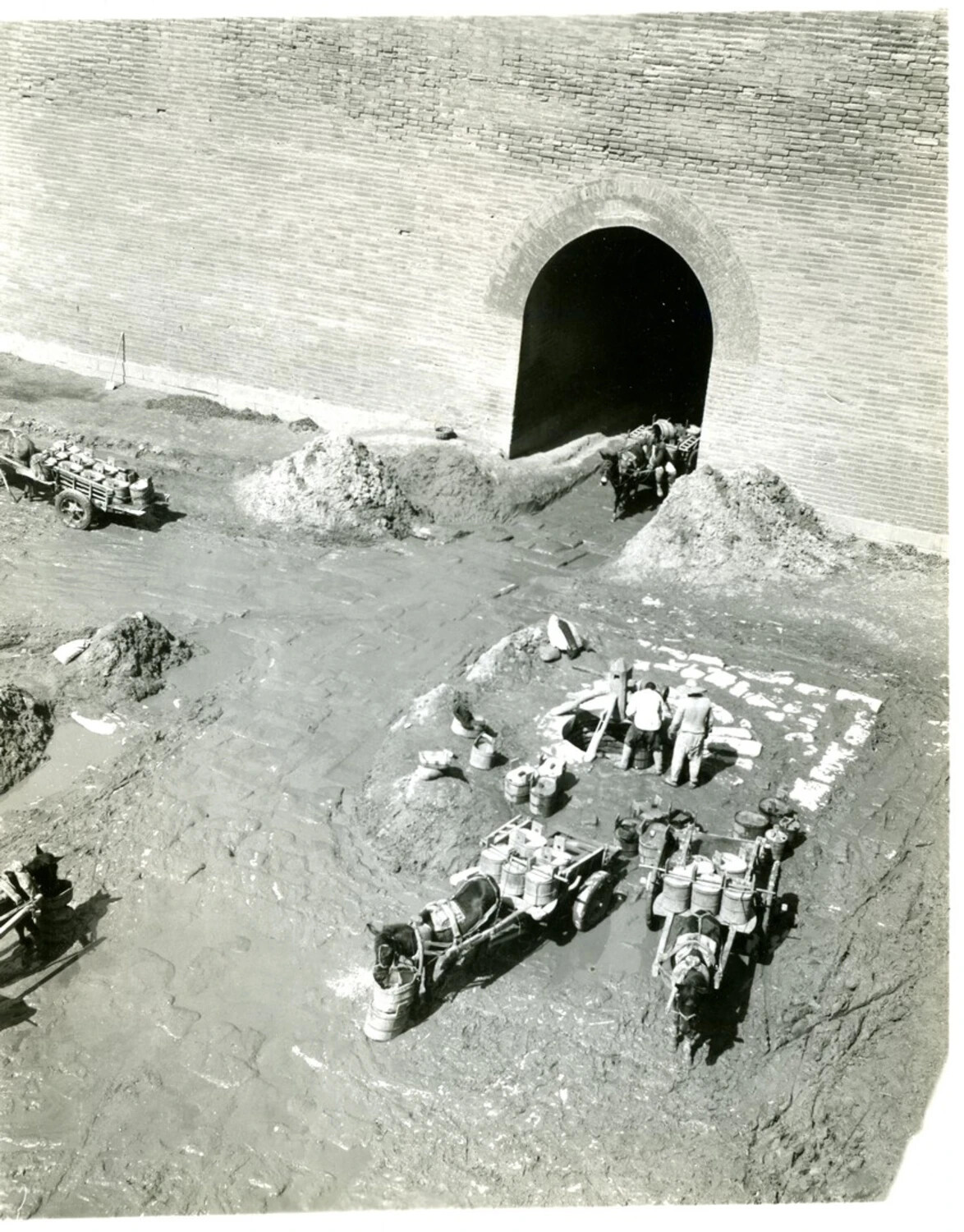 Water Carriers and Draft Animals Outside a City Gate, China-Burma-India Theater, World War II Era