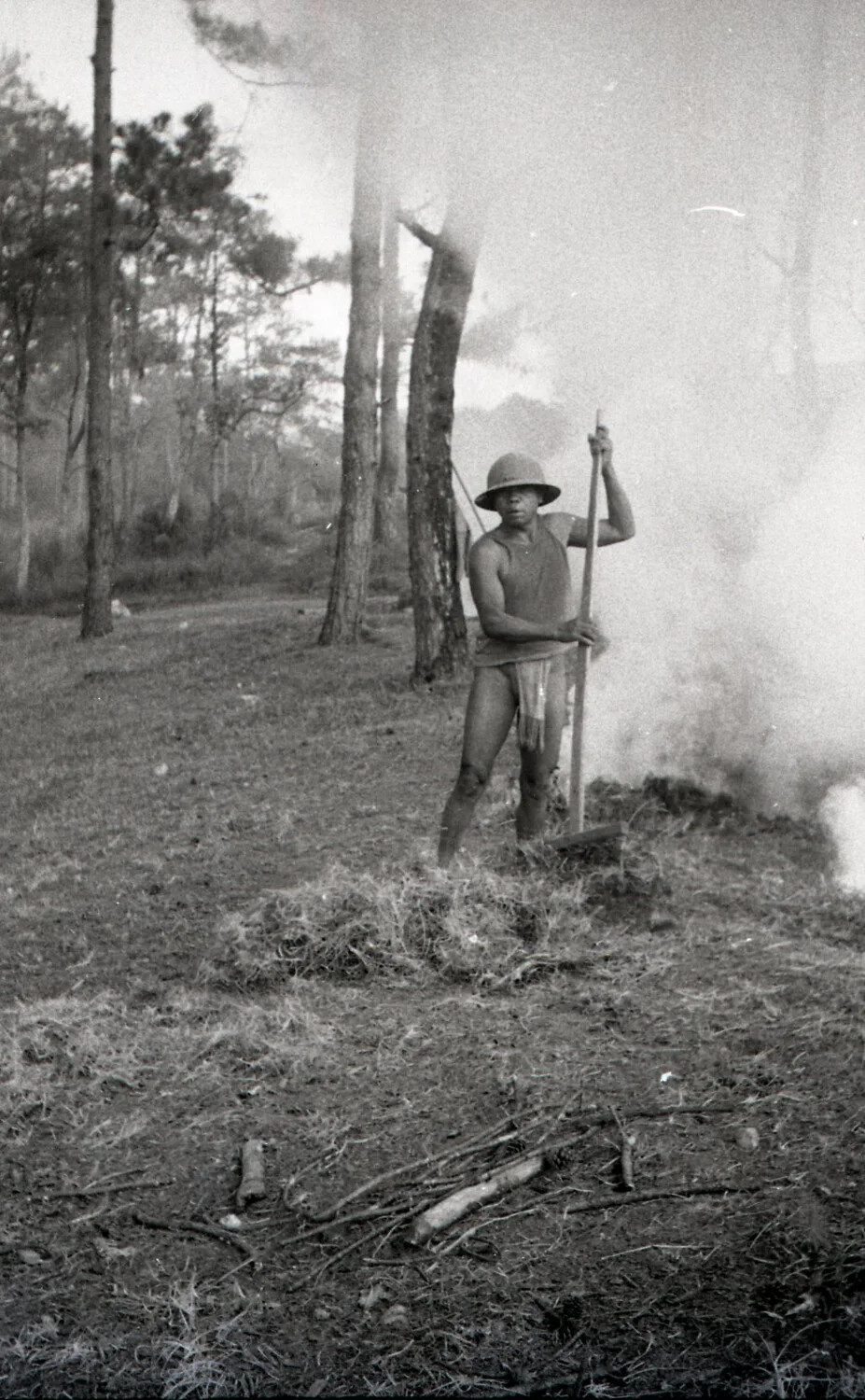 Filipino Worker Tending a Brush Fire in Pine Forest, Camp John Hay, Baguio, Philippines