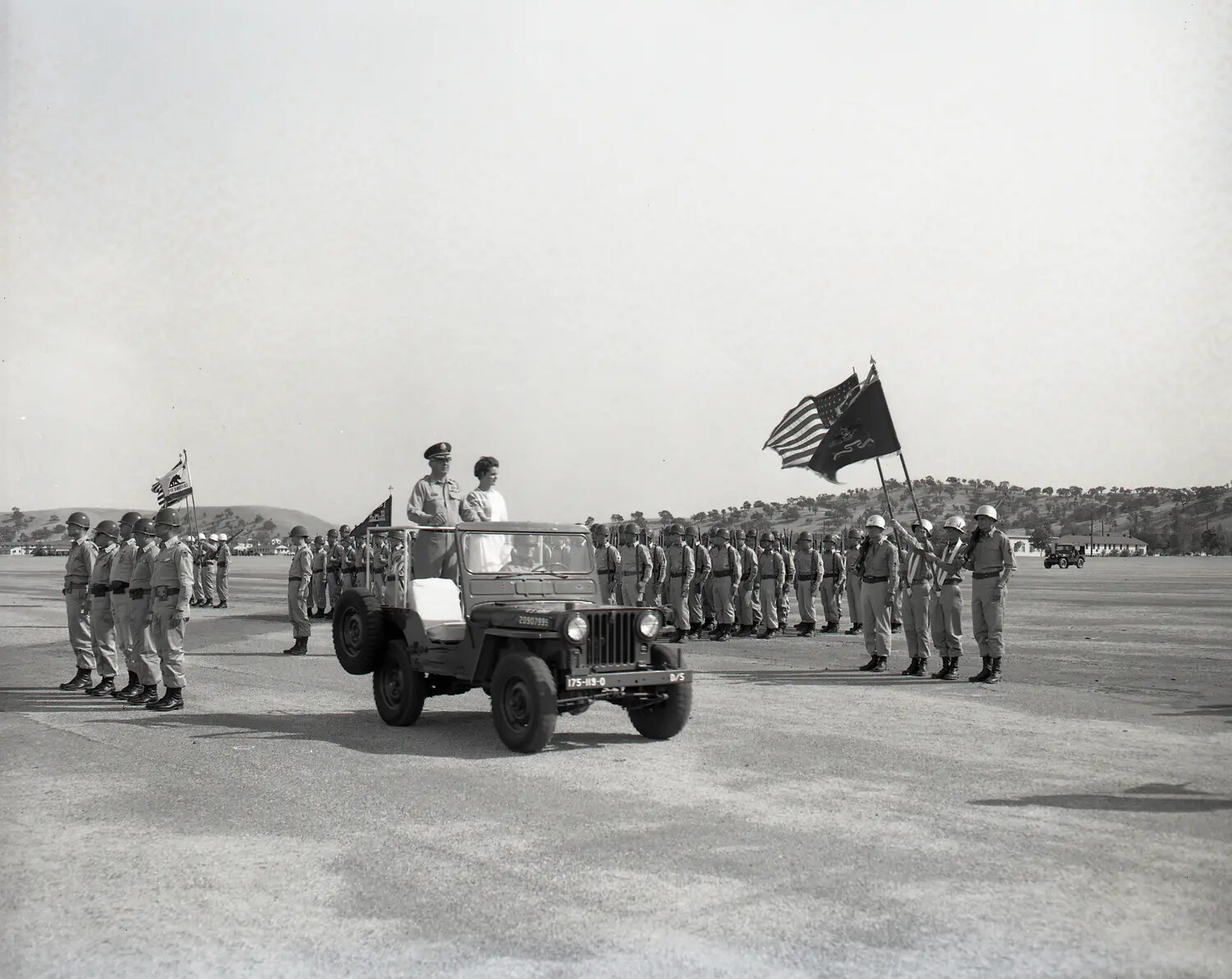 Miss California 1960 Suzanne Marie Reamo Reviews National Guard Troop Formation from Jeep
