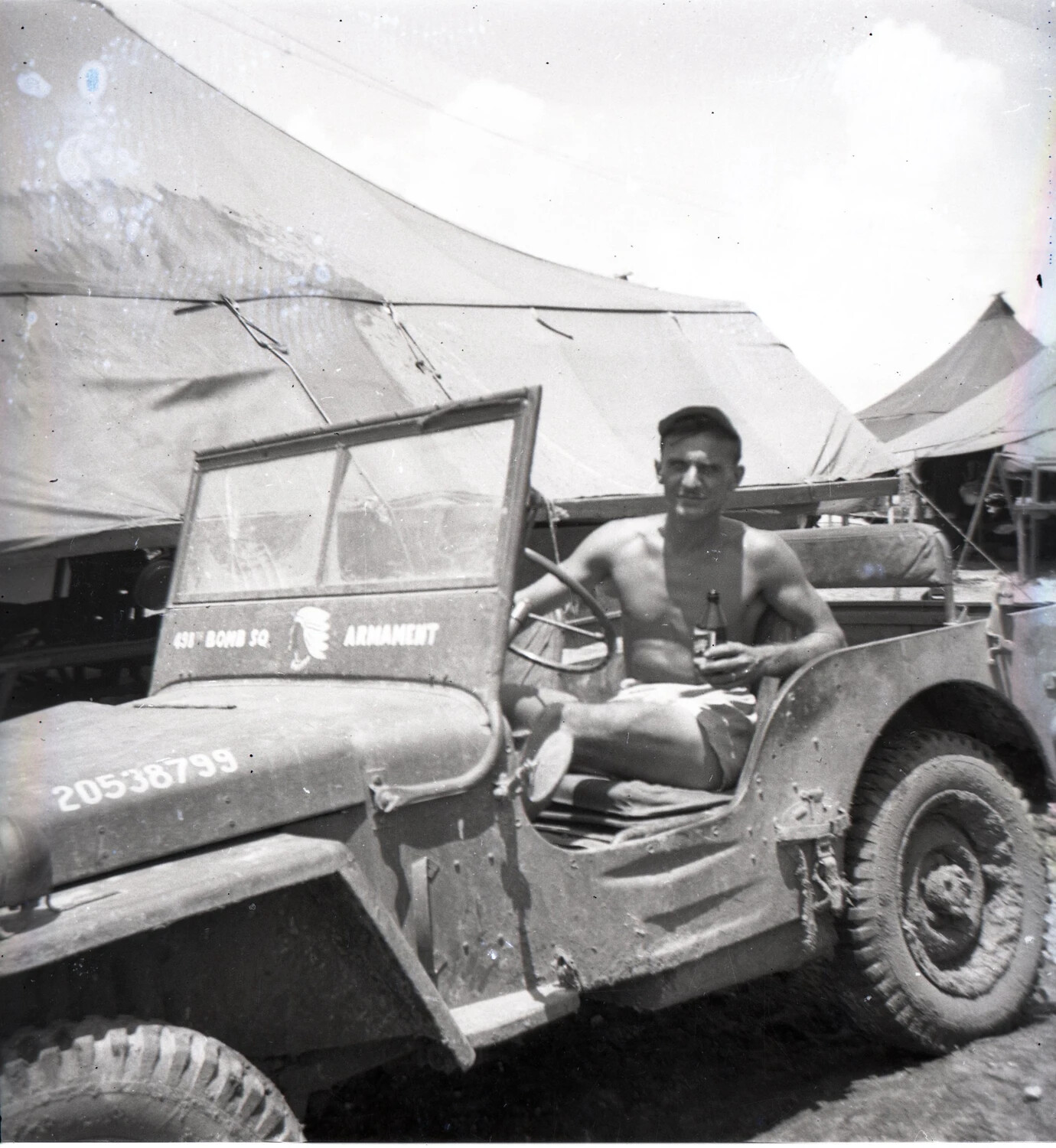 Airman of the 498th Bomb Squadron Armament Section Relaxing in Jeep, Pacific Theater, WWII