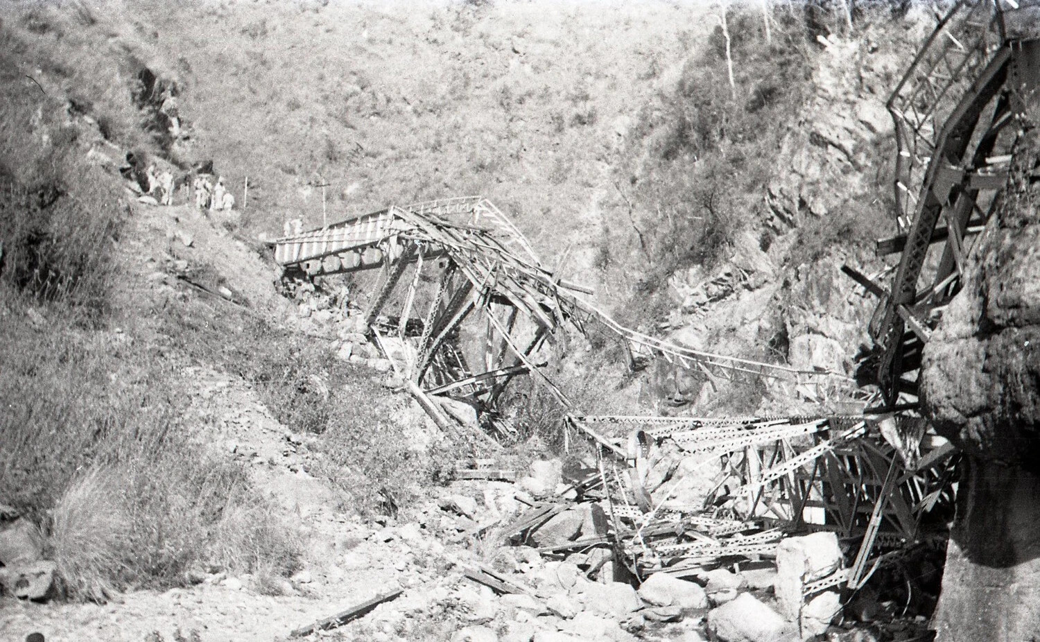 Wide View of Destroyed Steel Bridge with Soldiers on Roadside, Luzon, Philippines, World War II