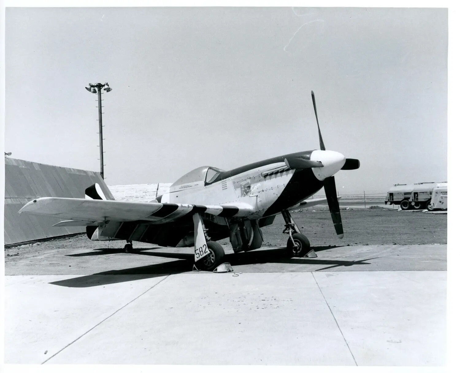 North American P-51 Mustang on Ramp, Striped Display/Racing Livery, Desert Airfield