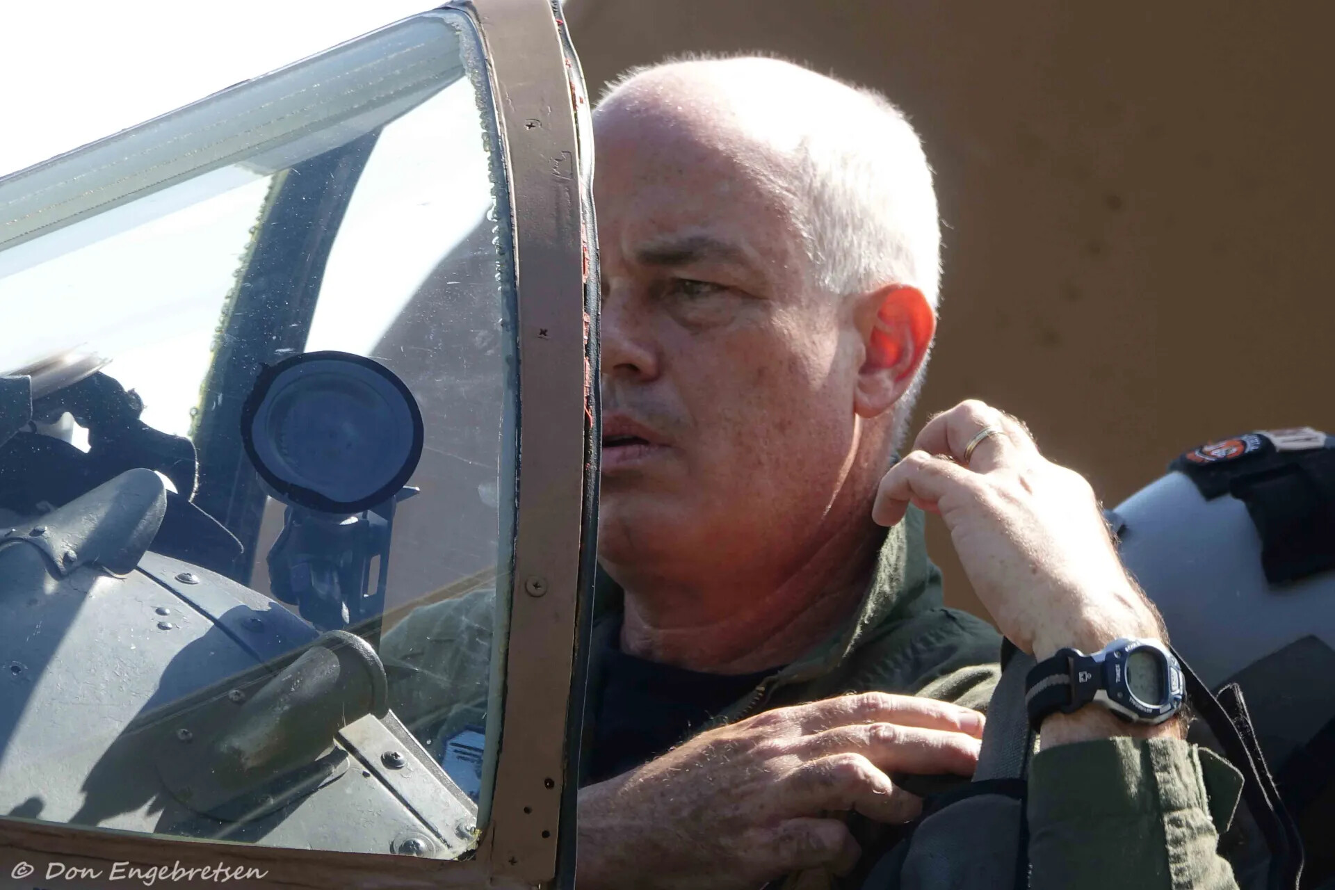 Skyraider Pilot in Profile Adjusting Harness, May 2019 Warbird Event