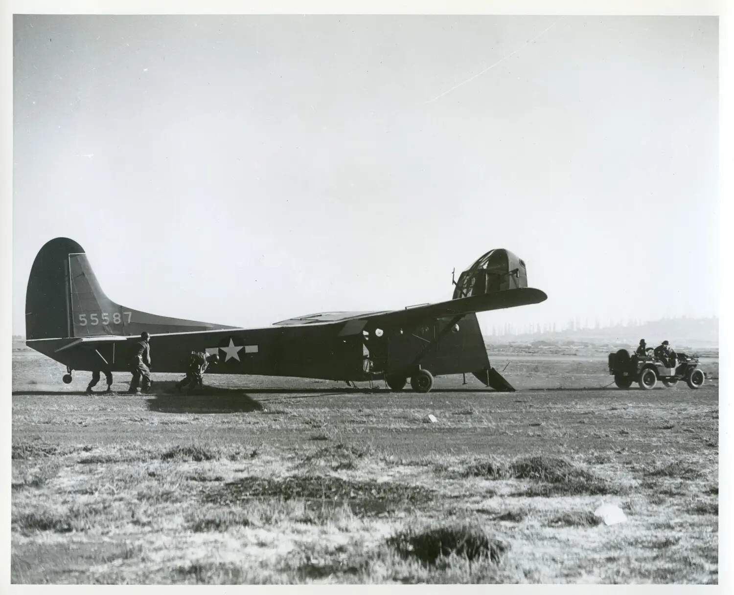 WACO CG-4A 'Hadrian' Troop/Cargo Glider, Serial No. 55587, on Airfield with Ground Crew and Jeep