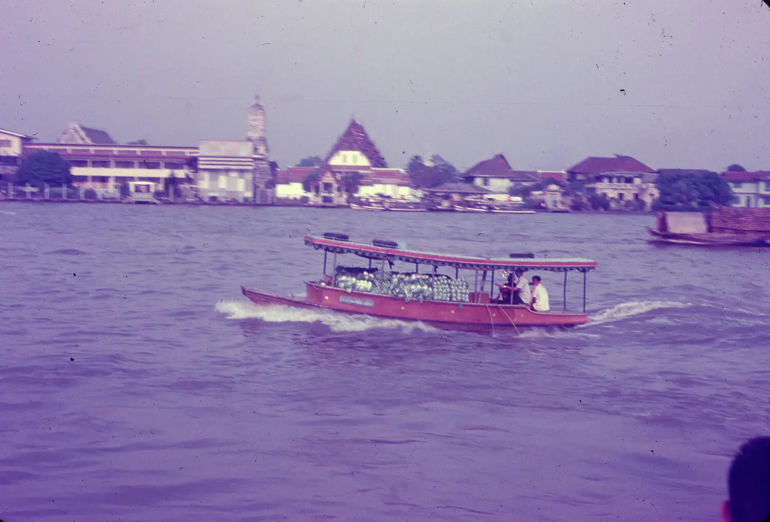 River Ferry Boat and Riverside Temple Skyline, Likely Bangkok, Thailand, 1965