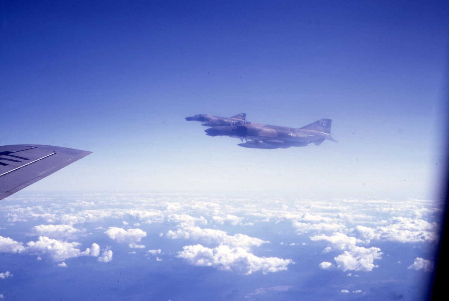 F-4 Phantom II Fighters (Tail Code 'FG') in Formation Above Clouds, Vietnam War Aerial Refueling Mission