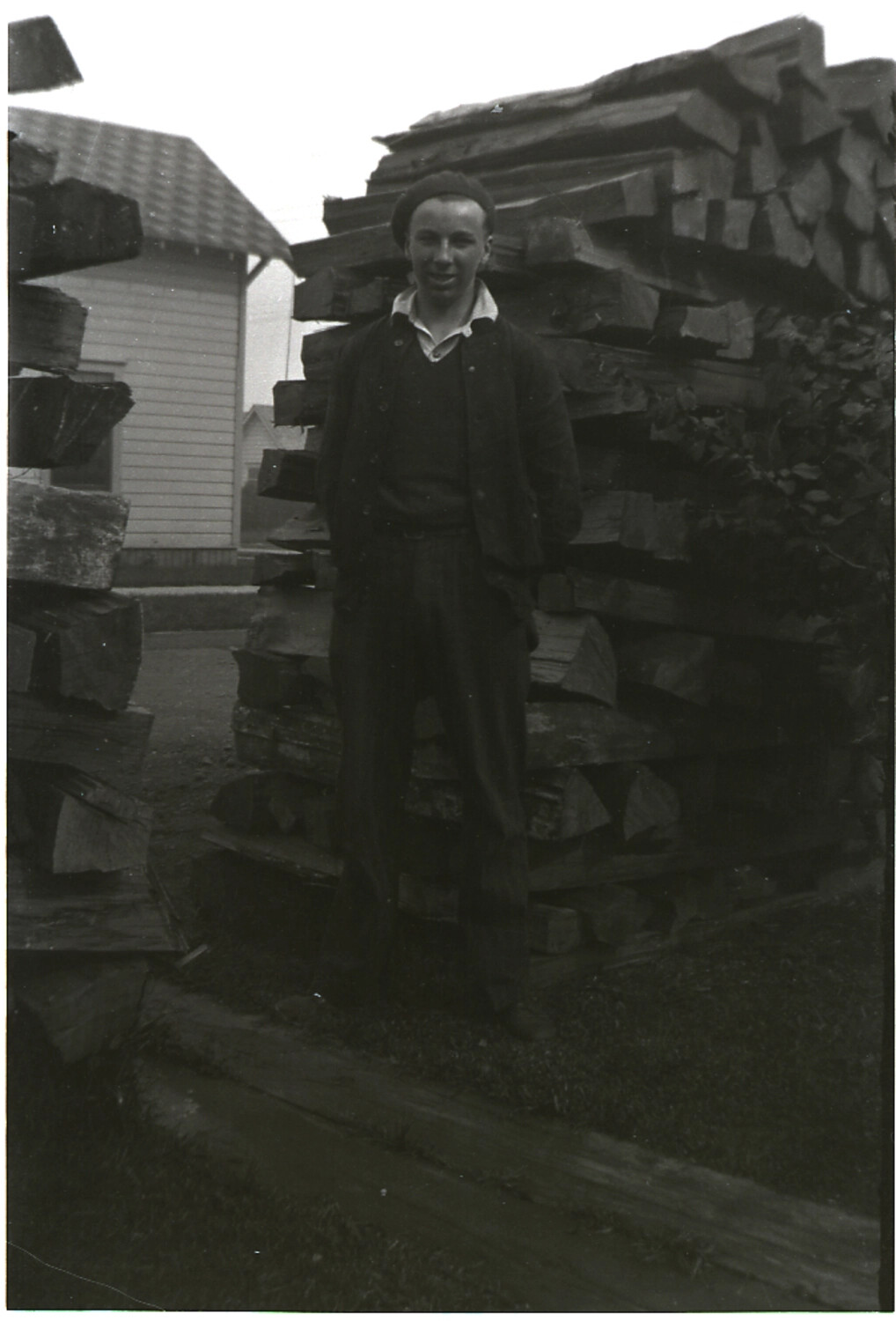 Young Man Posed Before a Cordwood Stack, Family Album Negative Misfiled with China Series