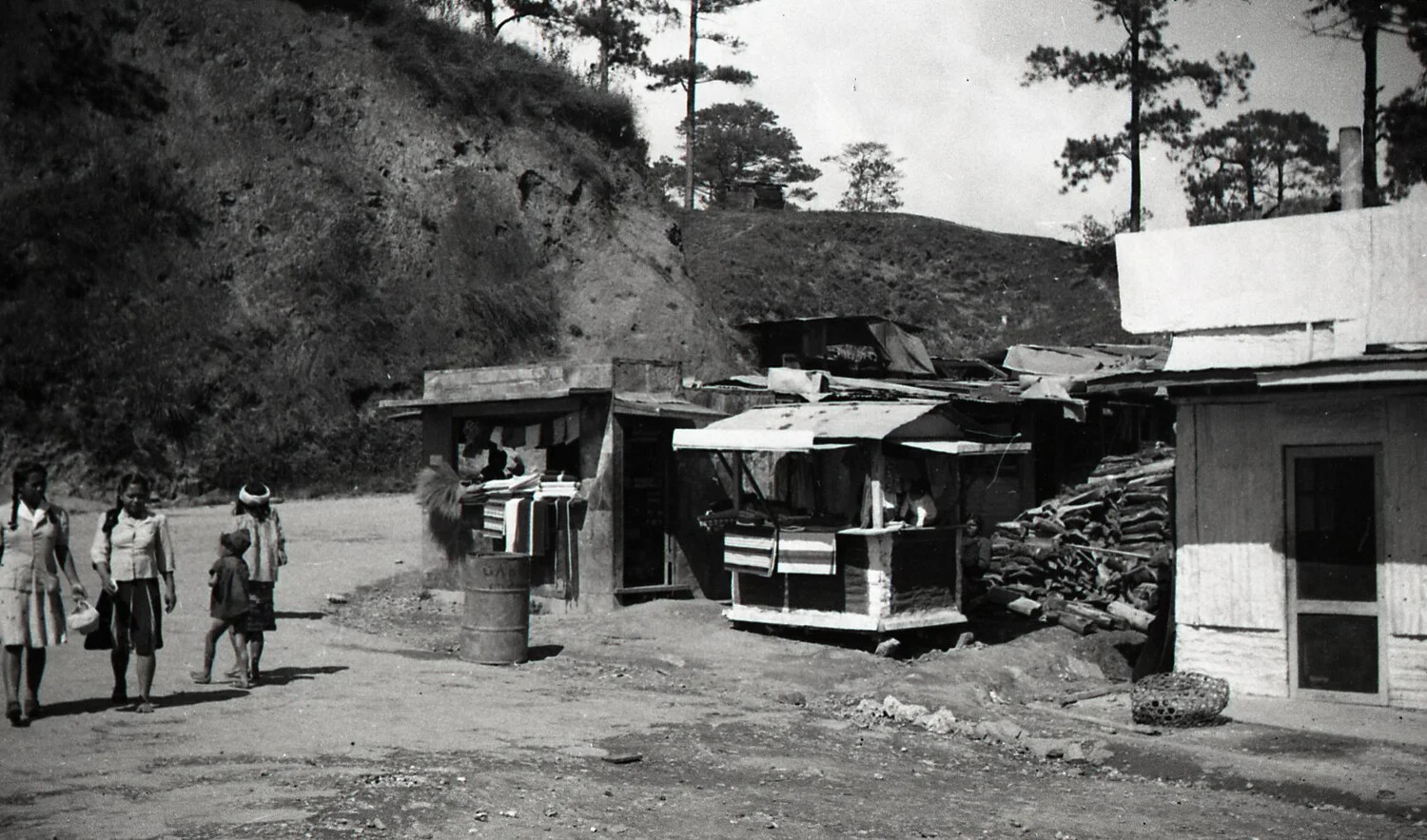 Roadside Vendor Stalls and Pedestrians on a Mountain Road, Luzon, Philippines, WWII Era
