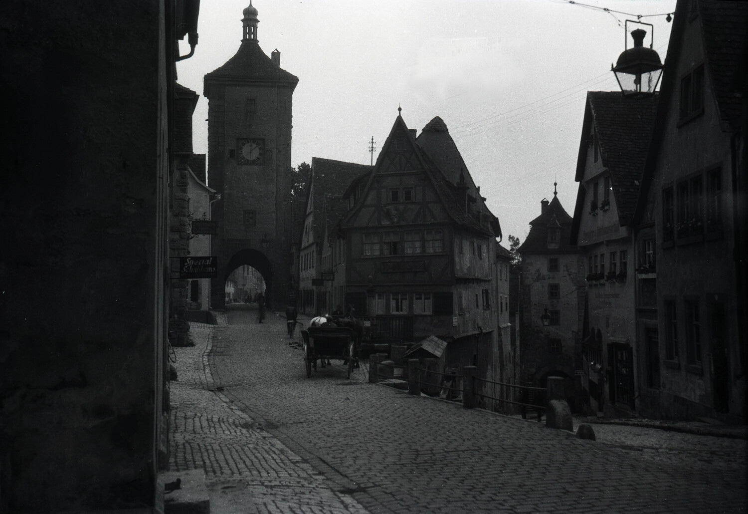 Medieval German Town Street with Clock Tower and Half-Timbered Houses, Postwar Germany