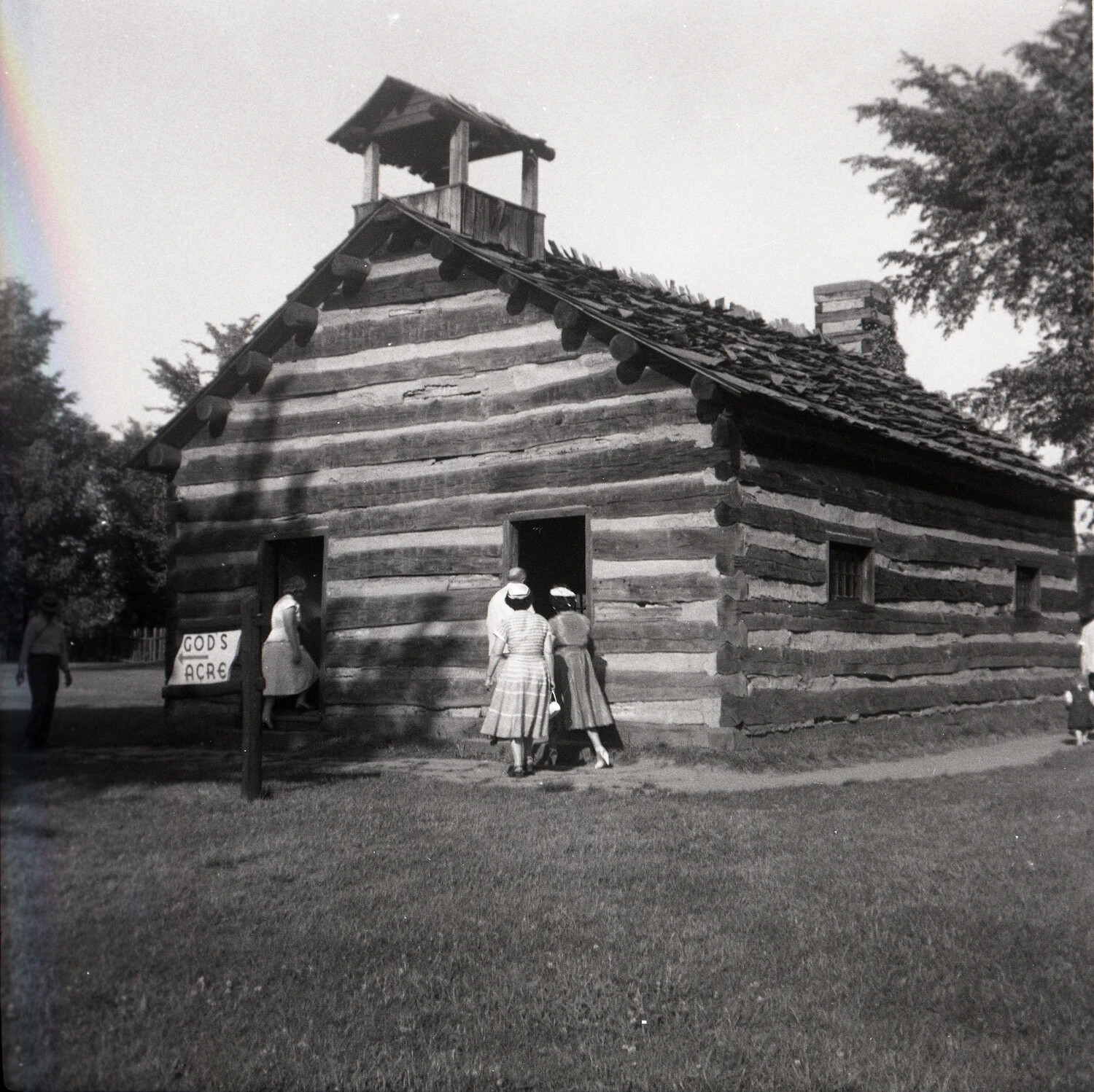 Historic Log Building with 'God's Acre' Cemetery Signpost, Family Visitors, circa 1950s-1960s